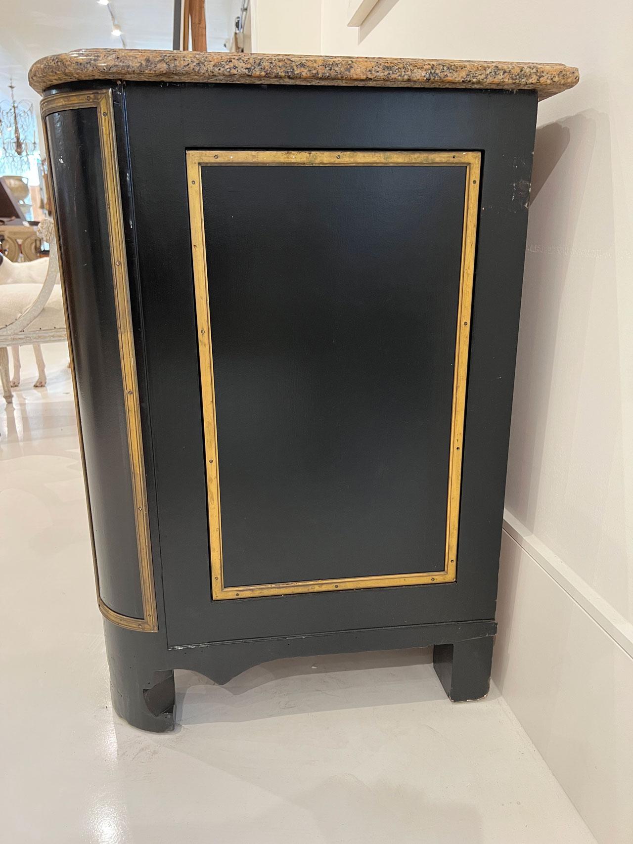This vintage noir three drawer commode is accented with gold paint and elaborate bronze pulls and escutcheon. A beautiful marble with ogee edge tops this fine piece. Curved apron enhances the appeal to have this showpiece in your space.