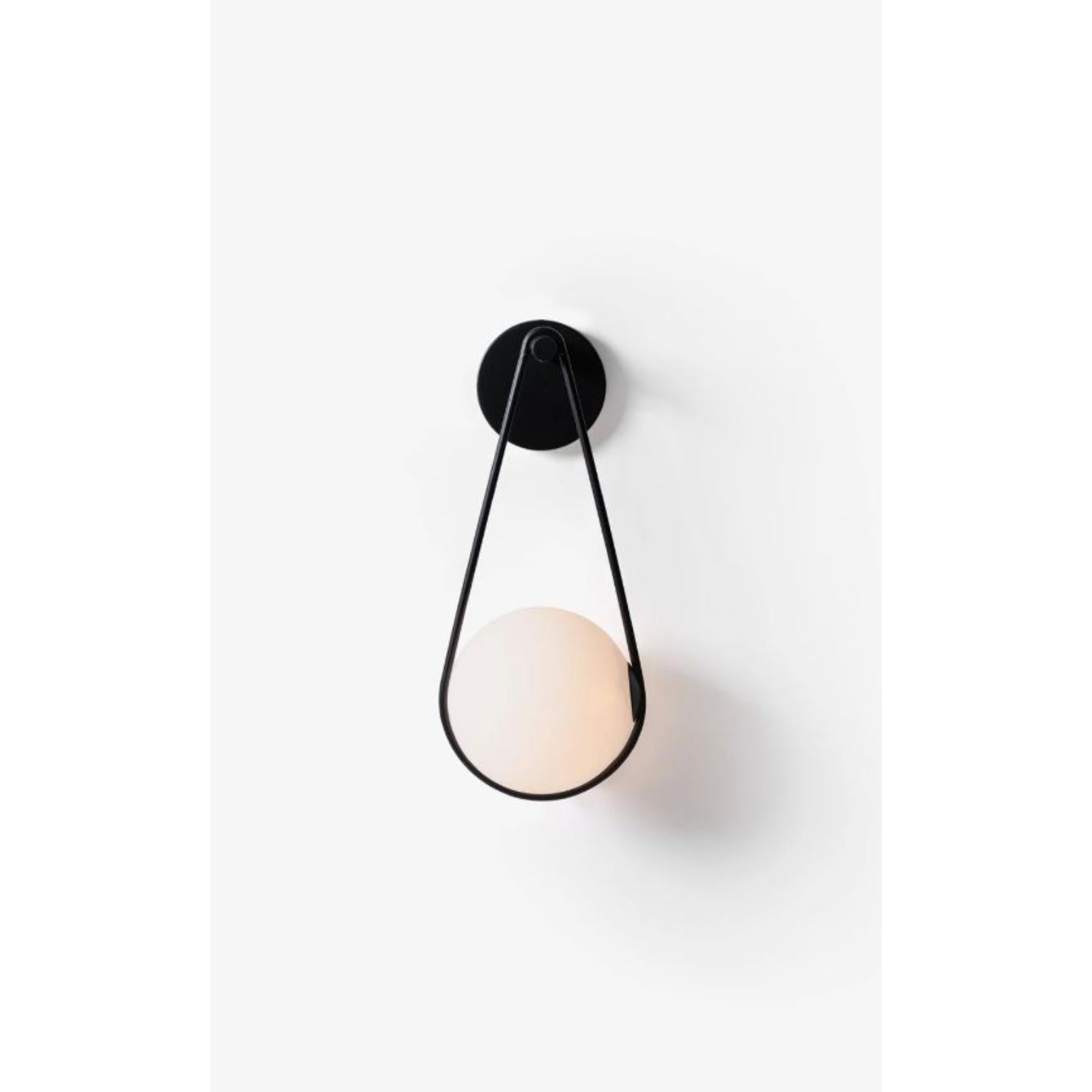 Black Corda Wall Lamp by Wentz
Dimensions: D 22 x W 22 x H 55 cm
Materials: Aluminum, Blown Glass.


WEIGHT: 1,2kg / 2,6 lbs
Colors: Black, White
LIGHT SOURCE: Built-in LED. 150lm. 2700K. 80 CRI.
DIMMING ELV @ 120VAC.
VOLTAGE: 120-277V -