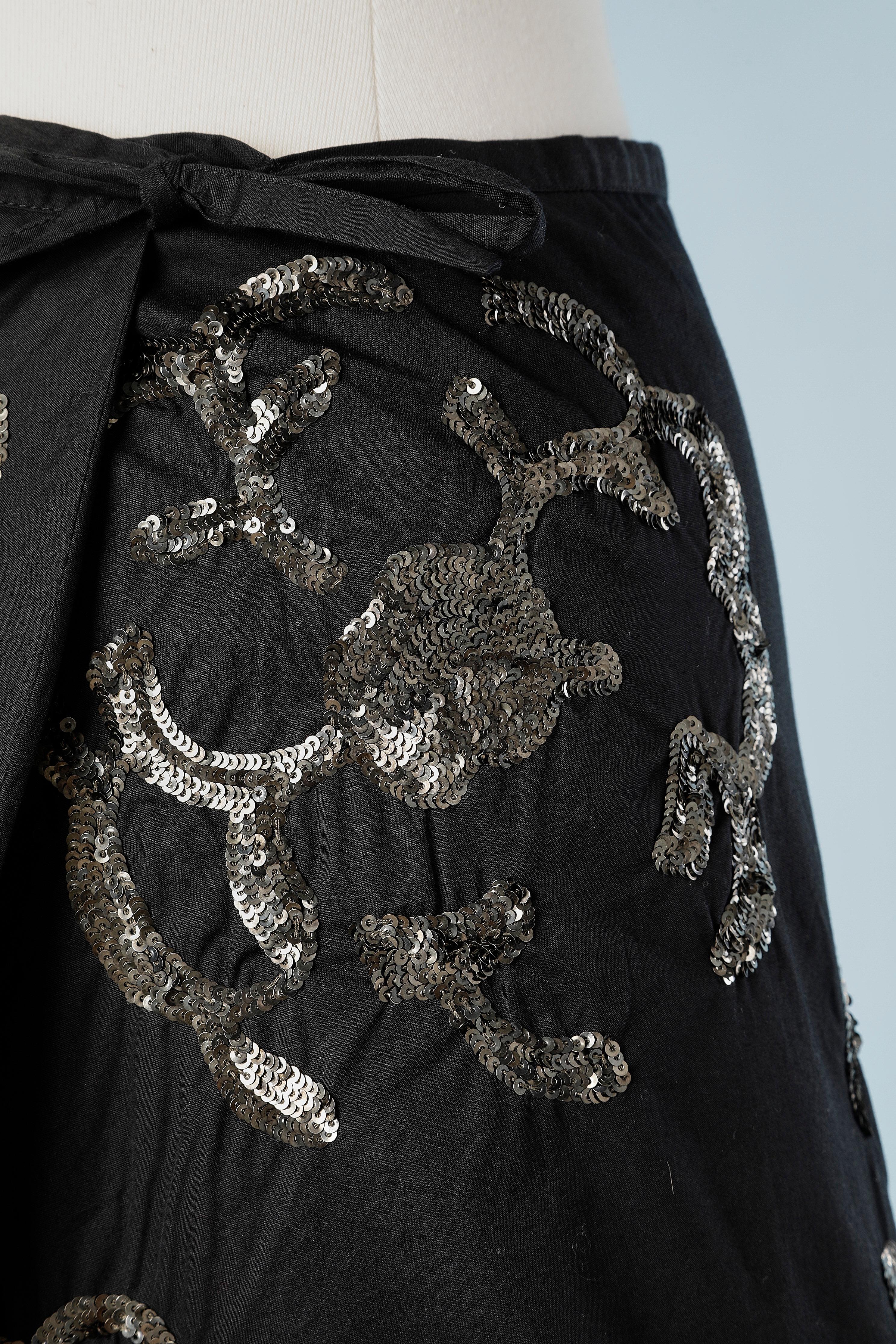 Black cotton wrap skirt with sequin embroideries; bow closure. Same cotton lining.
SIZE 36 / M ( adjustable) 
NEW with tag 