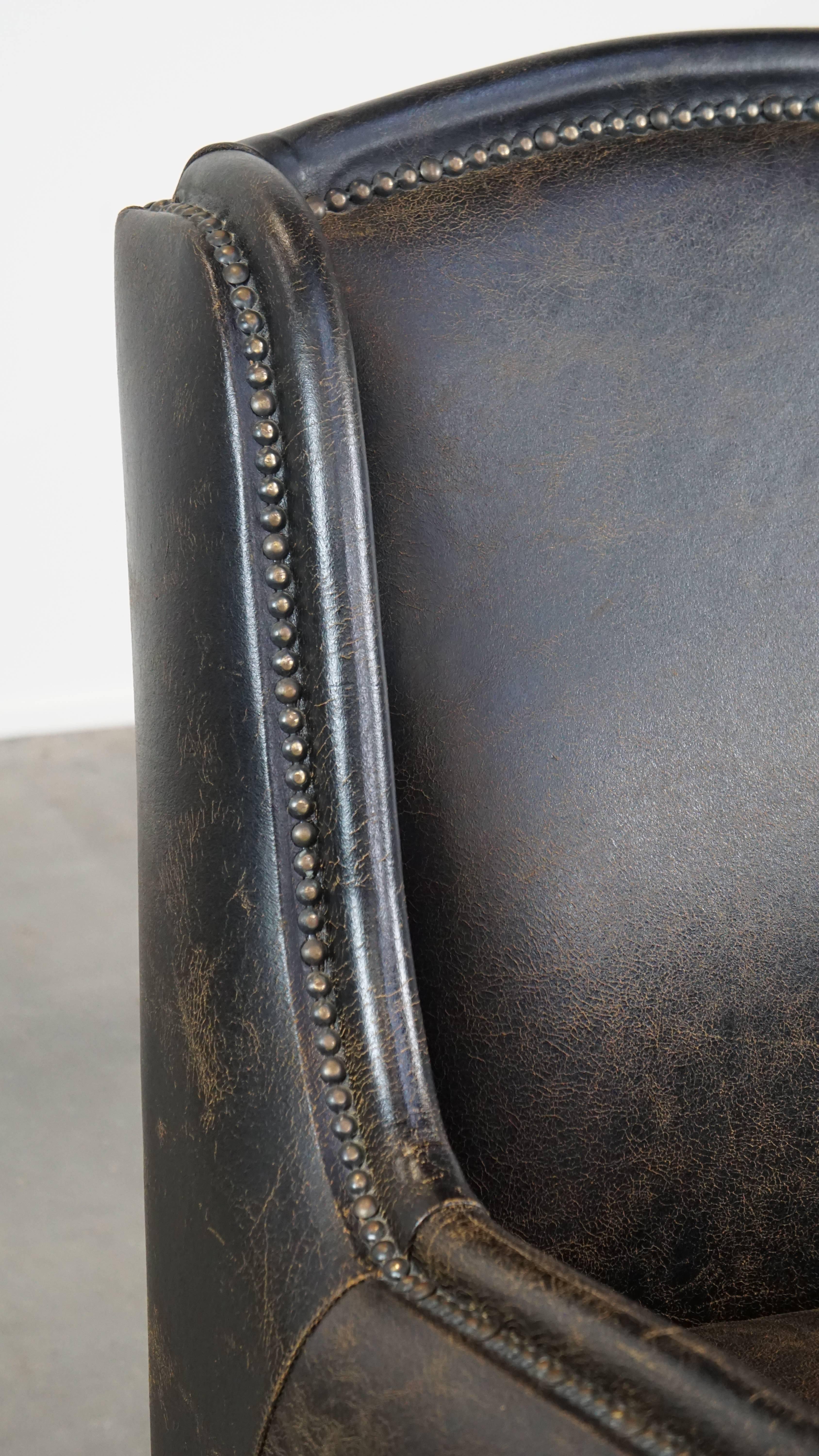 Black cow leather armchair finished with decorative nails, industrial style For Sale 4