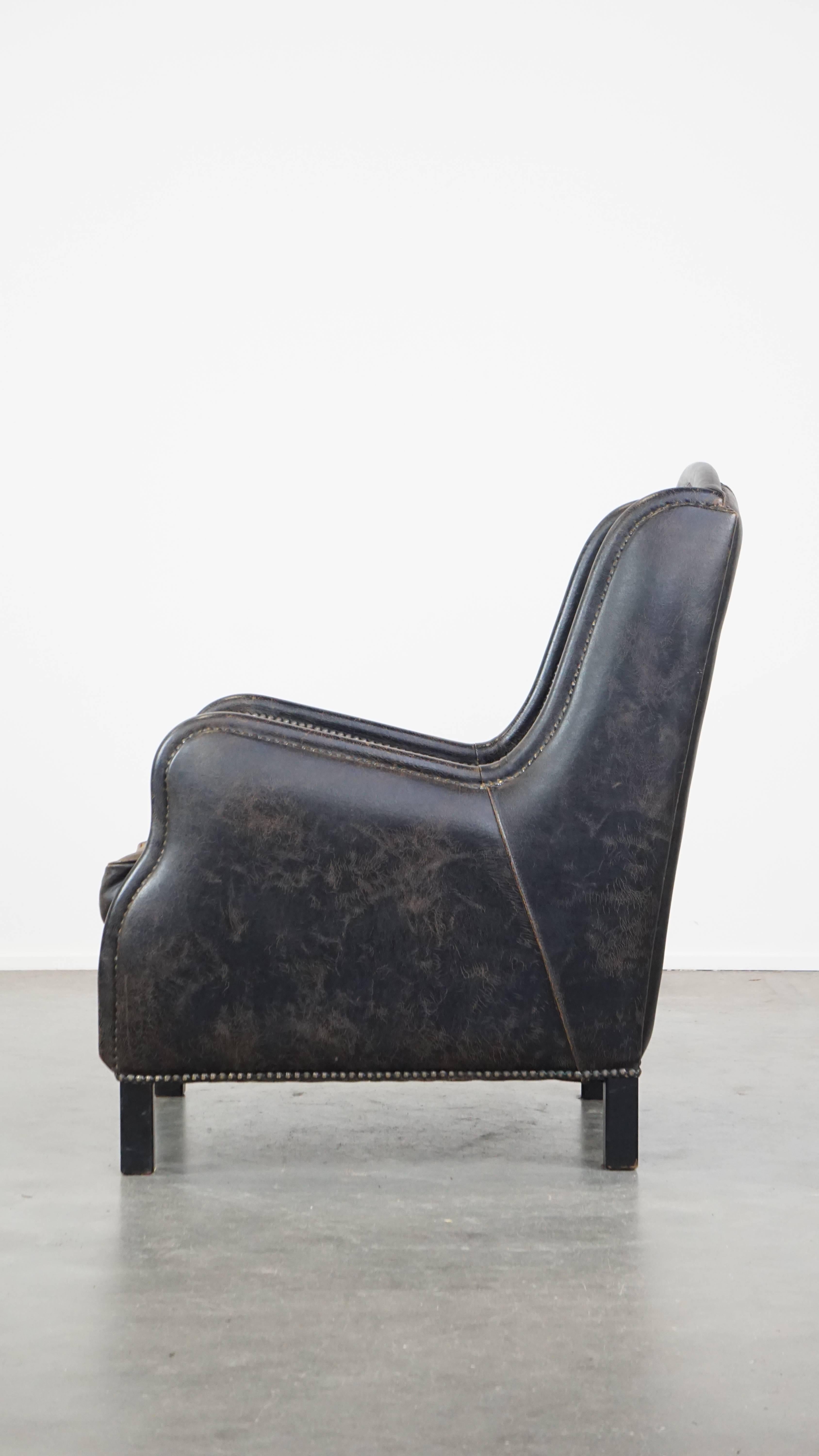 Black cow leather armchair finished with decorative nails, industrial style In Good Condition For Sale In Harderwijk, NL
