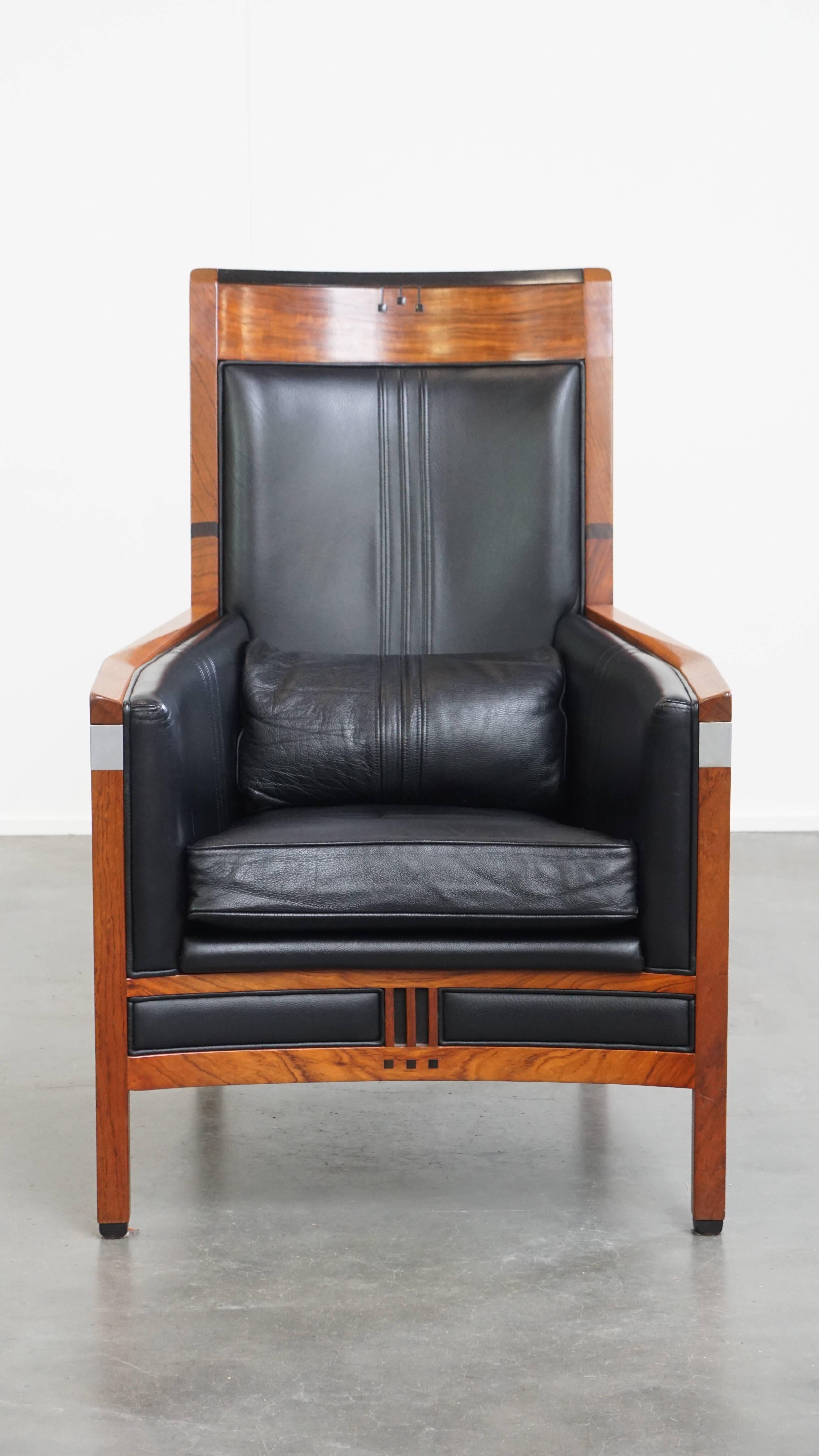 Offered here is this beautiful black cowhide leather and wooden Art Deco design armchair by Schuitema from the Decoforma series.
A piece designed and crafted by Schuitema is synonymous with exceptional design and top-quality craftsmanship — and this