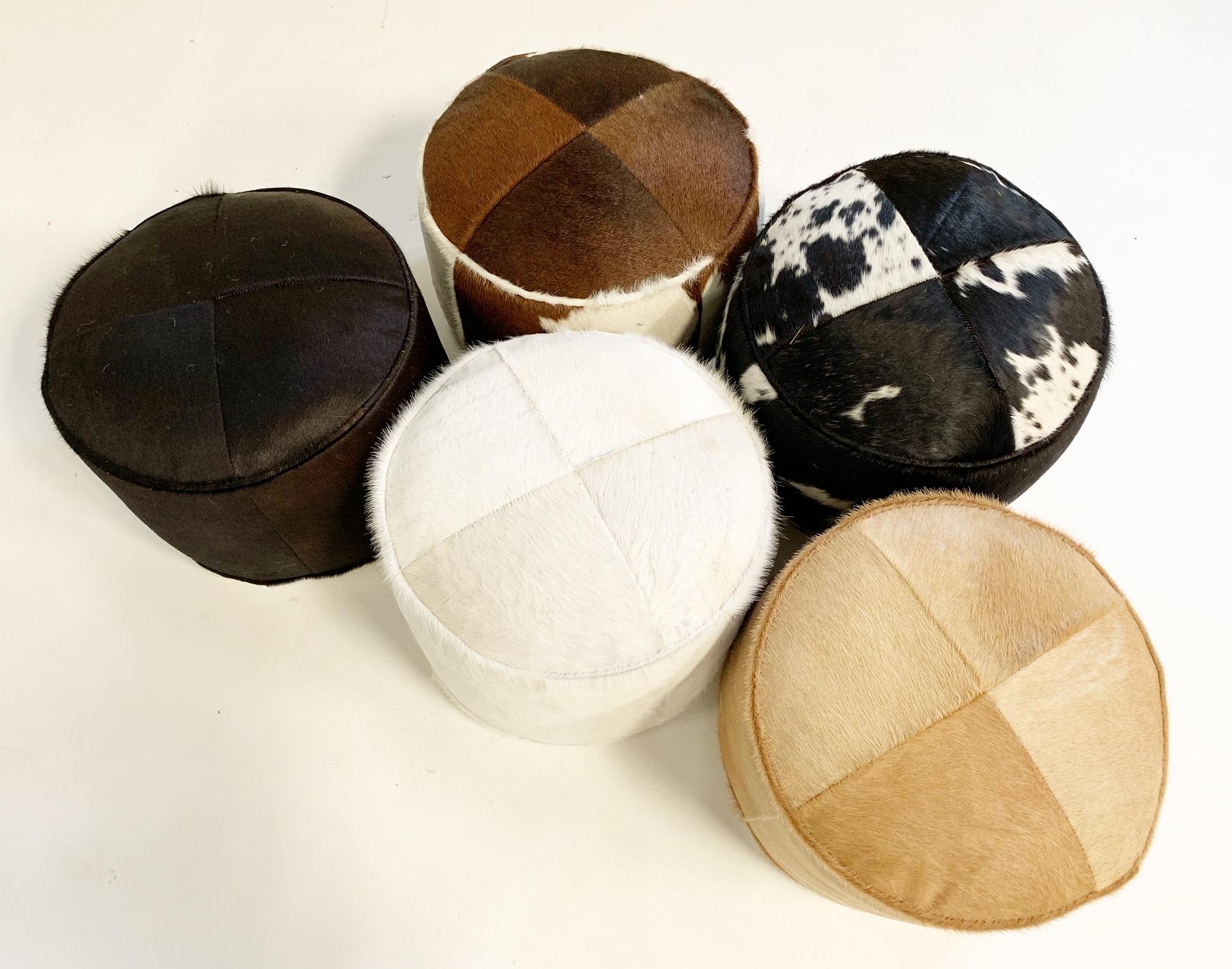 Our luxurious cowhide pouf ottomans are handcrafted from our beautiful Forsyth Brazilian cowhides. The most beautiful cowhides are selected hand cut, hand stitched and hand stuffed. Down feathers fill each pouf, 12 pounds to be exact, and each is