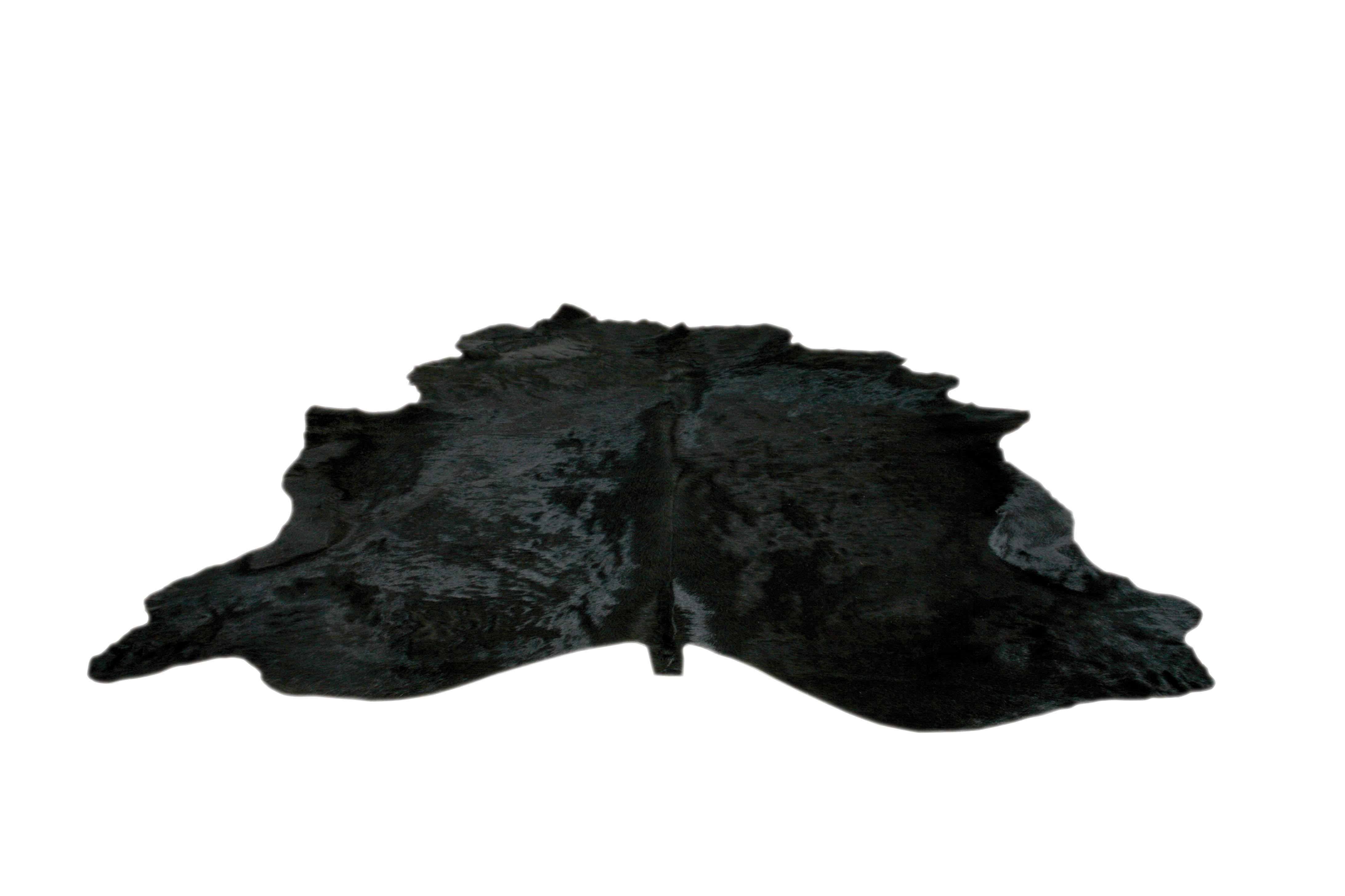 Black cowhide rug. 

All of our hair Cowhides are full hides and measure approximately 7' W x 8' L. They are of the highest quality from the French region of Normandy and naturally raised in a free roaming field. The hair of these cows is very