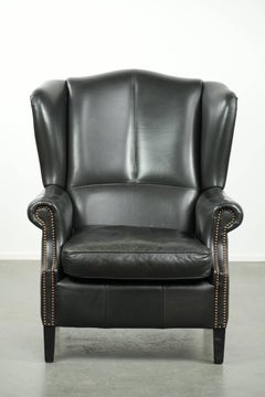 Black cowhide wingback armchair in classic English style