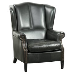 Black cowhide wingback armchair in classic English style