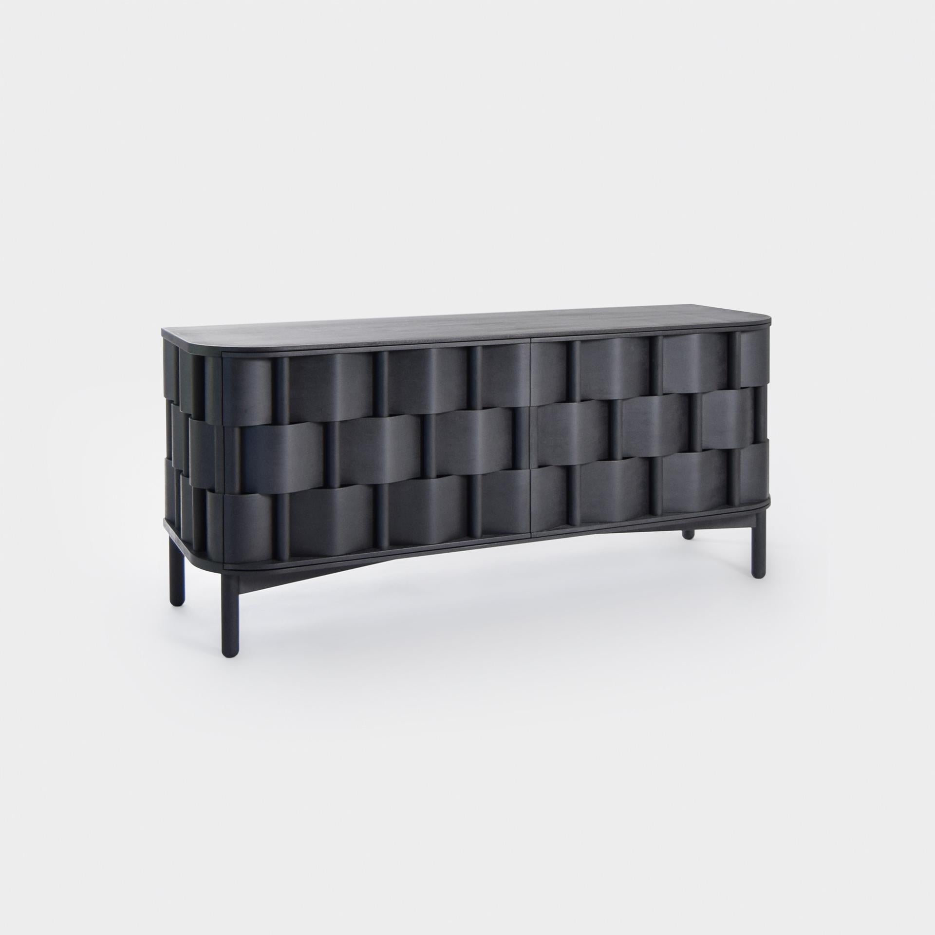 Weave W133-Black
Black sideboard, made of solid birchwood and laminated birchveneér. Modern yet Classic, bold yet modest the cabinet serves as a great example of Scandinavian contemporary design. Designed by Lukas Dahlén.

The minimal yet