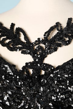 Black crêpe jumpsuit with sequins embroidered