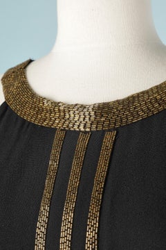 Black crêpe rayon evening dress with gold glass beads embroideries