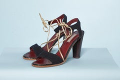 Black crêpe sandal with gold leather shoelace Nina Ricci