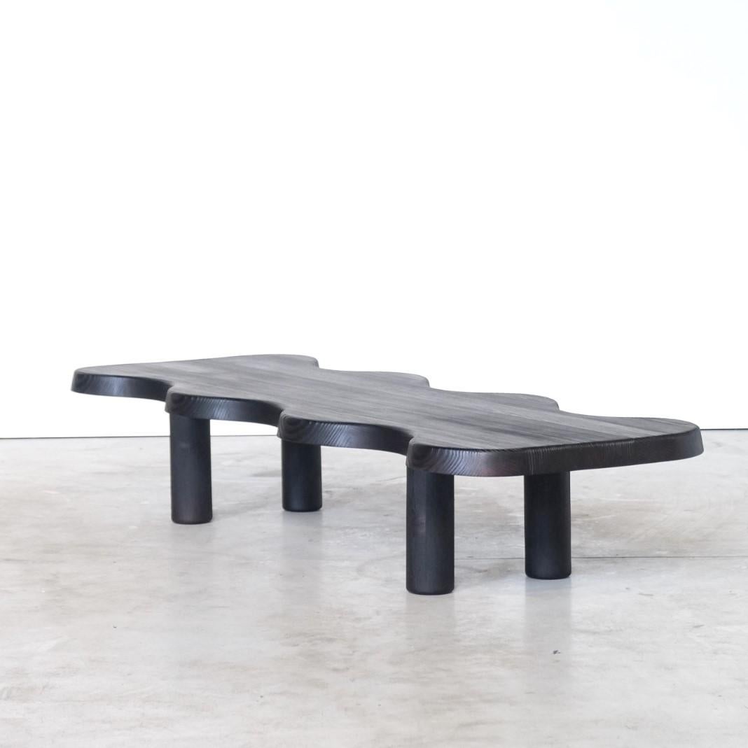 Black crocodile low table by Atelier Thomas Serruys.
Dimensions: L 180cm, W 63cm, H 33cm
Materials: Solid Ooregon.

A soft edged symmetrical shaped coffee table in solid Oregon with hand-turned, demountable legs.

After running nine years a