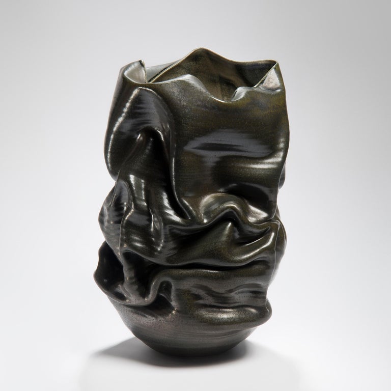 Black Crumpled Form No 18 is a unique ceramic sculptural vessel by the British artist Nicholas Arroyave-Portela.

Nicholas Arroyave-Portela’s professional ceramic practice began in 1994. After 20 years based in London, he moved and set up his