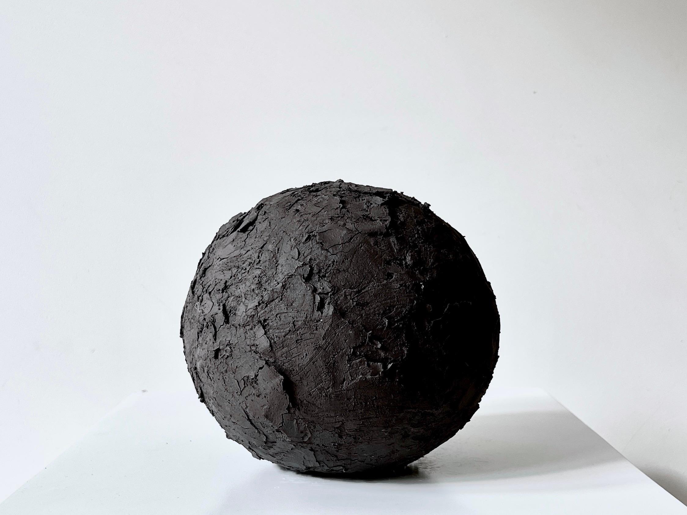 Black Crust sphere II by Laura Pasquino
One of a kind
Dimensions: Ø 18 x H 18 cm
Materials: stoneware ceramic
Finishing: textured stoneware

Laura Pasquino
Incorporating references from ancient Korean ceramics as well as principles of