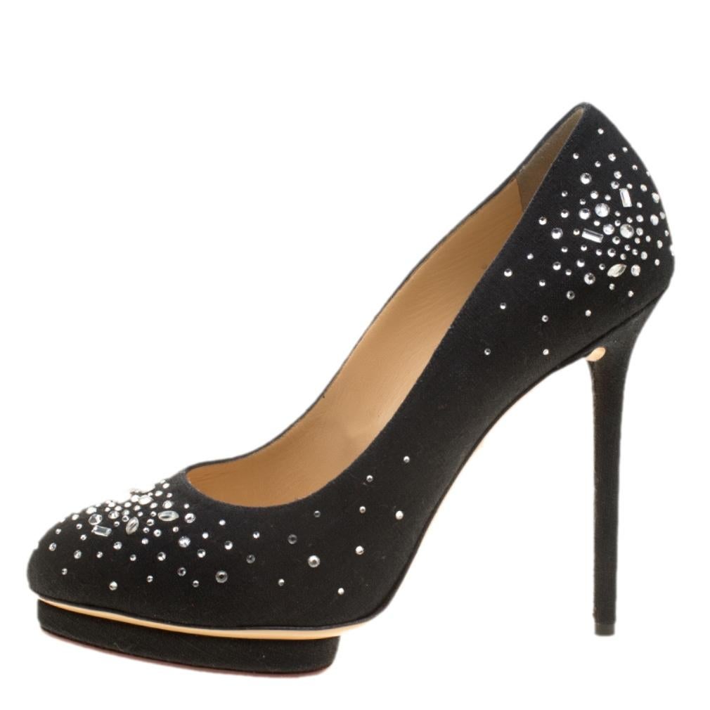 Designed with care and love, this pair of Charlotte Olympia pumps will help you dazzle everyone whenever you step out! Crafted out of linen in a classy black shade and decorated with crystals, this number is from their Dotty collection. They've been