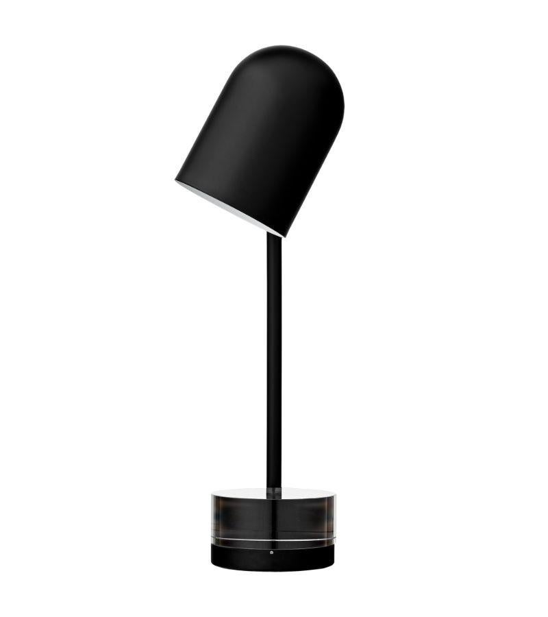 Black cylinder table lamp
Dimensions: Diameter 12 x height 50 cm 
Materials: Glass, iron w. Brass plating & powder coating.
Details: For all lamps, the recommended light source is E27 max 25W&220/240 voltage. We recommend LED in order to avoid