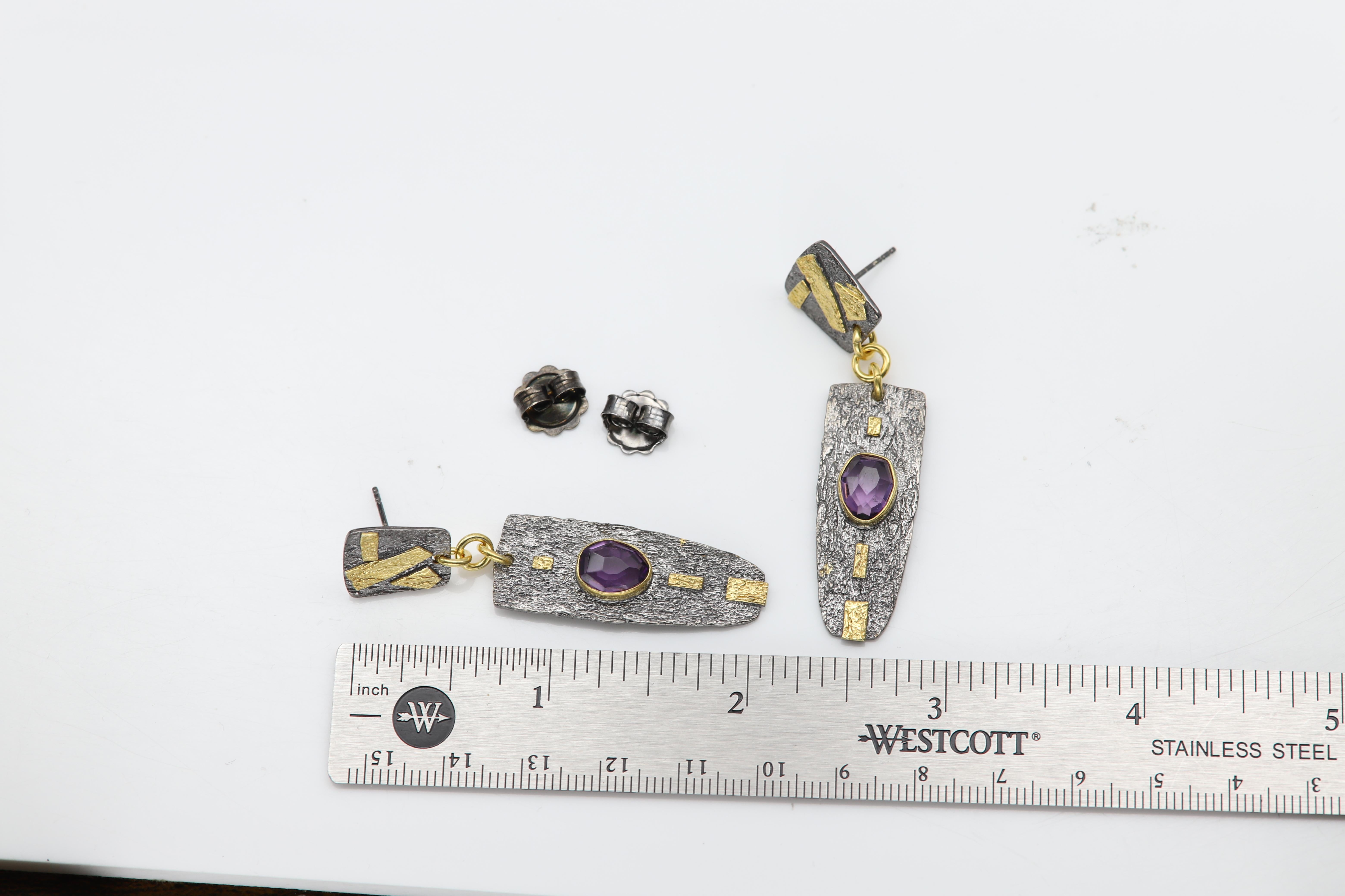 New Lovely
Dangle and antique Vintage Look
Sterling Silver 925 and Oxidized Silver that creates the black look.
Encrusted with Real 20k Gold
and with Natural Purple Amethyst 
Weight:  approx 12.30 grams (both together)
Size: approx dangling 2'