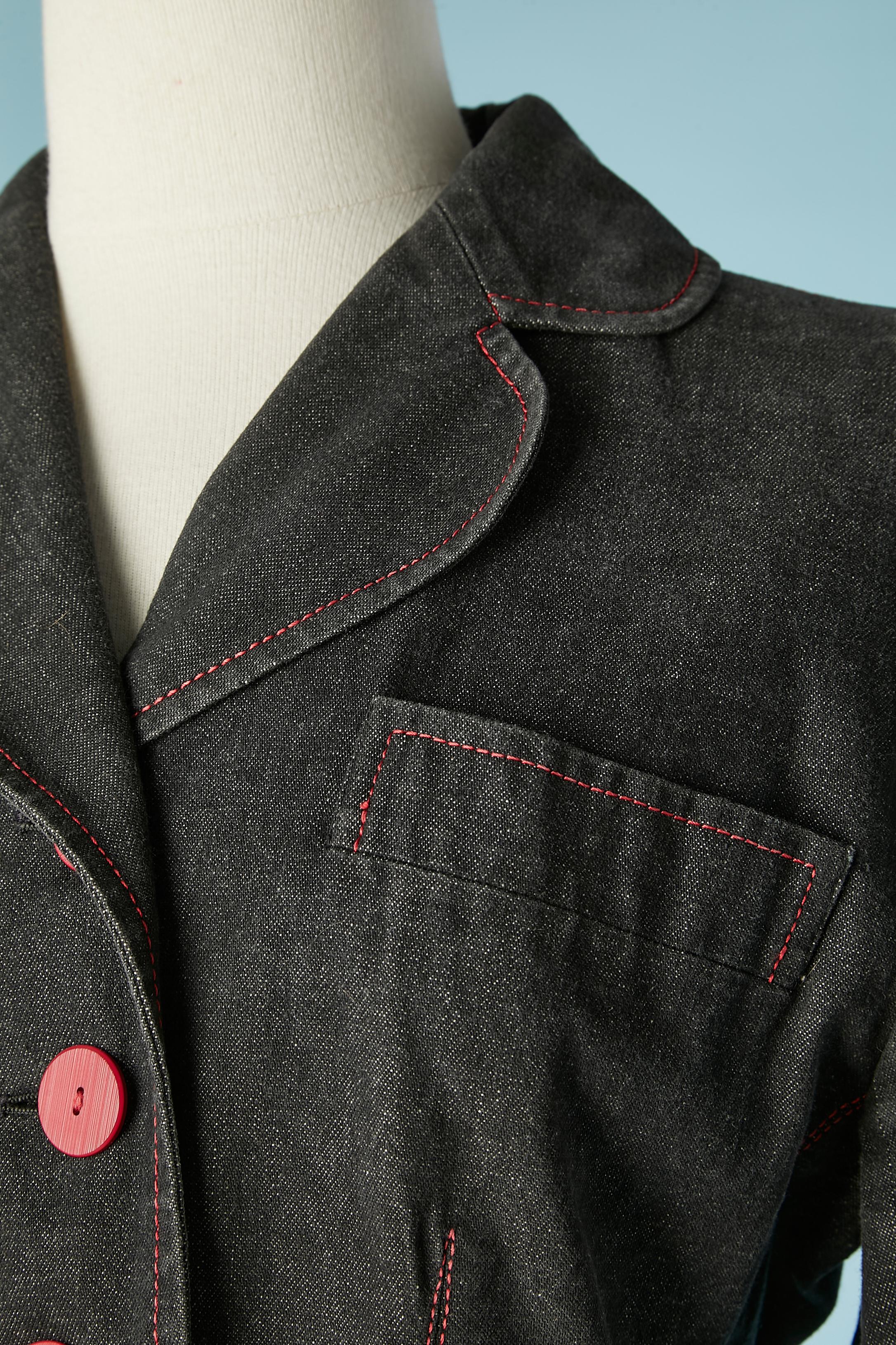 Black denim single breasted jacket with red buttons. Main fabric: 100% cotton. Lining: rayon or acetate. Red top-stitching.
SIZE 40 (Fr)  10 (US) 