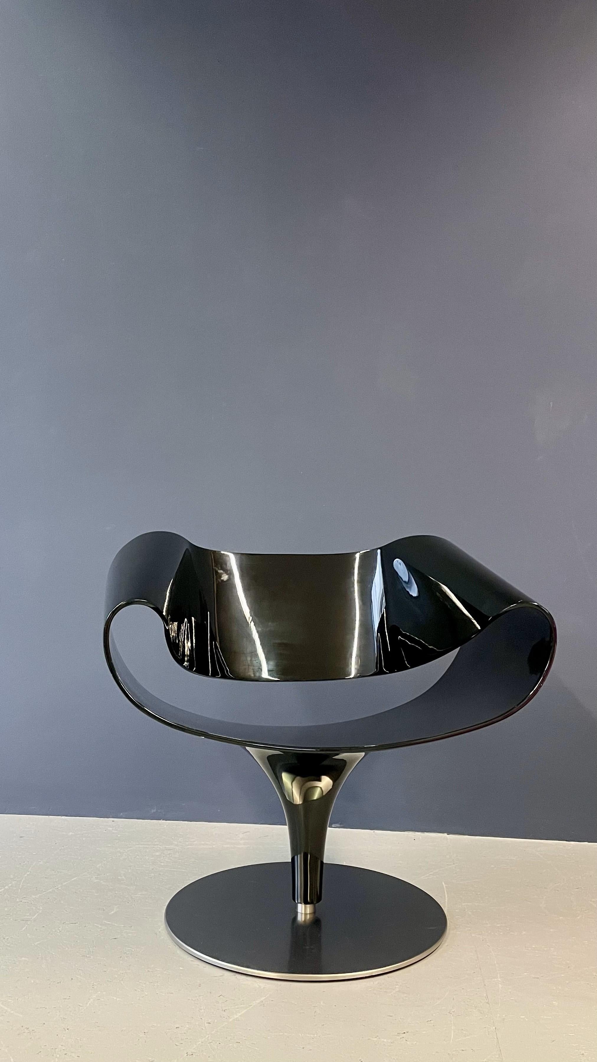 Sleek and sophisticated, this black designer chair combines modern style with comfort. Its minimalist silhouette and premium finish make it an elegant addition to any contemporary space.