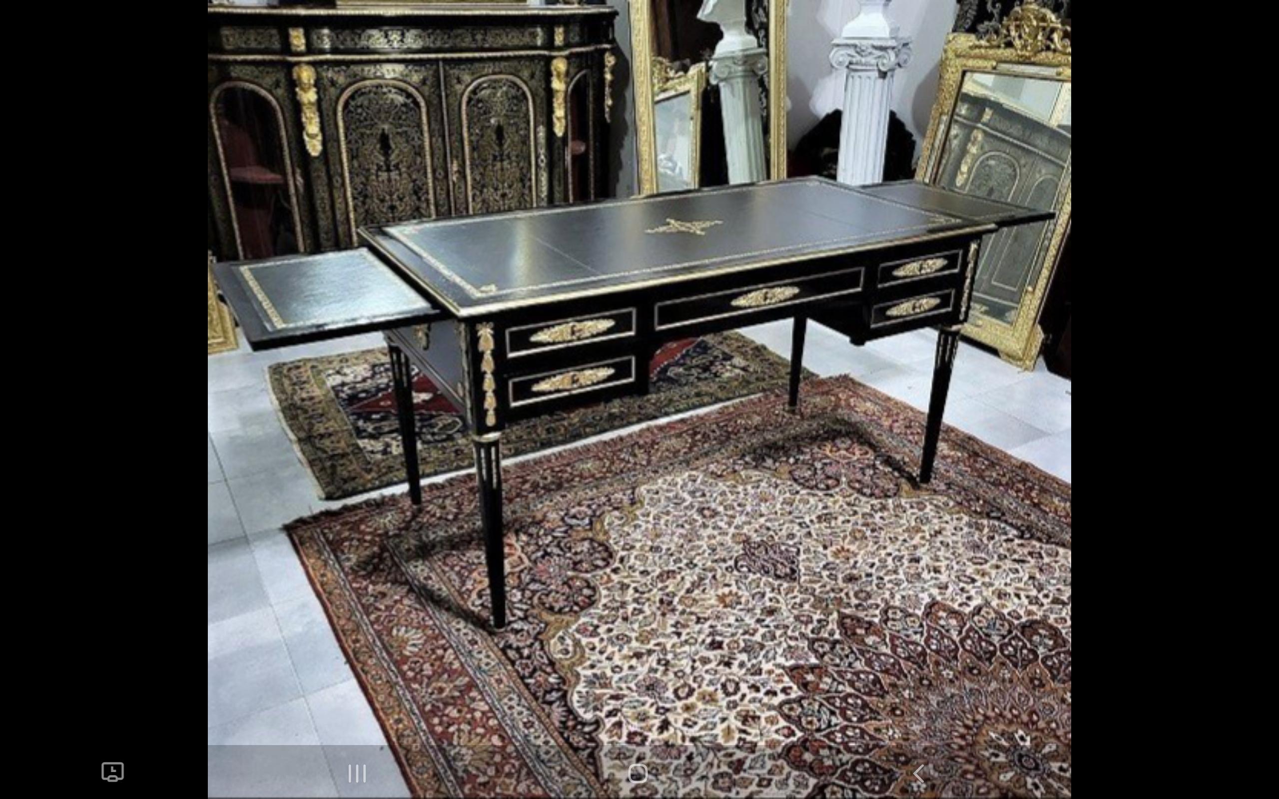Beautiful black table desk with 2 side open parts to make it bigger, from the Napoleon III period.
Important ornamentation of gilded bronzes with ingot molds, patterns on the sides and spandrels, keyholes, hooves, asparagus, openwork gallery with