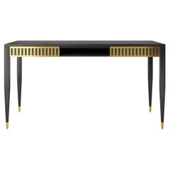 Black desk with two drawers, shelf and brass fronts in mid century modern style