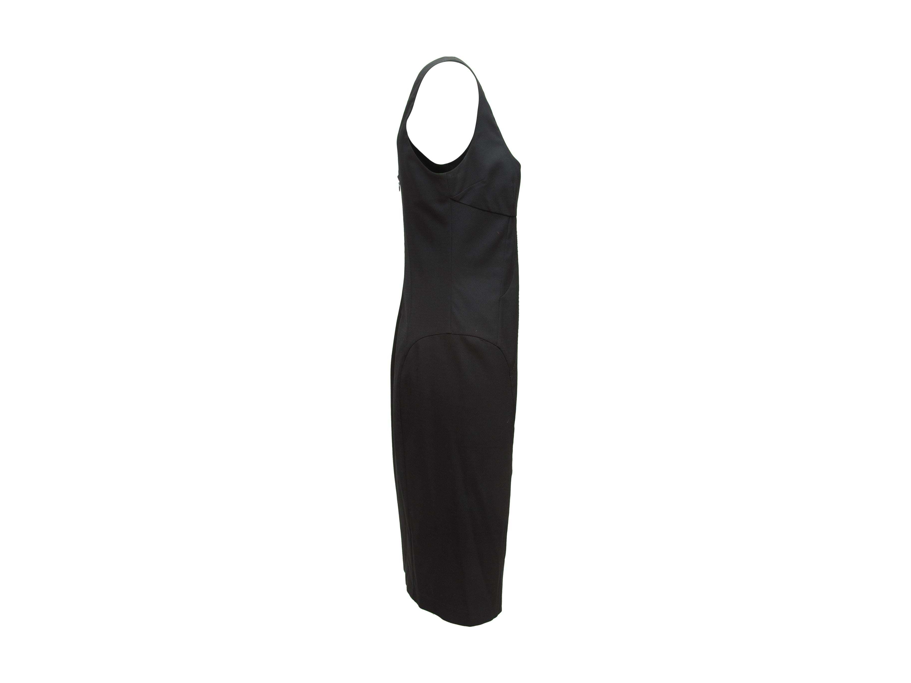 Product details: Black sleeveless fitted dress by D&G. Scoop neck. Zip closure at back. Designer size 44. 35