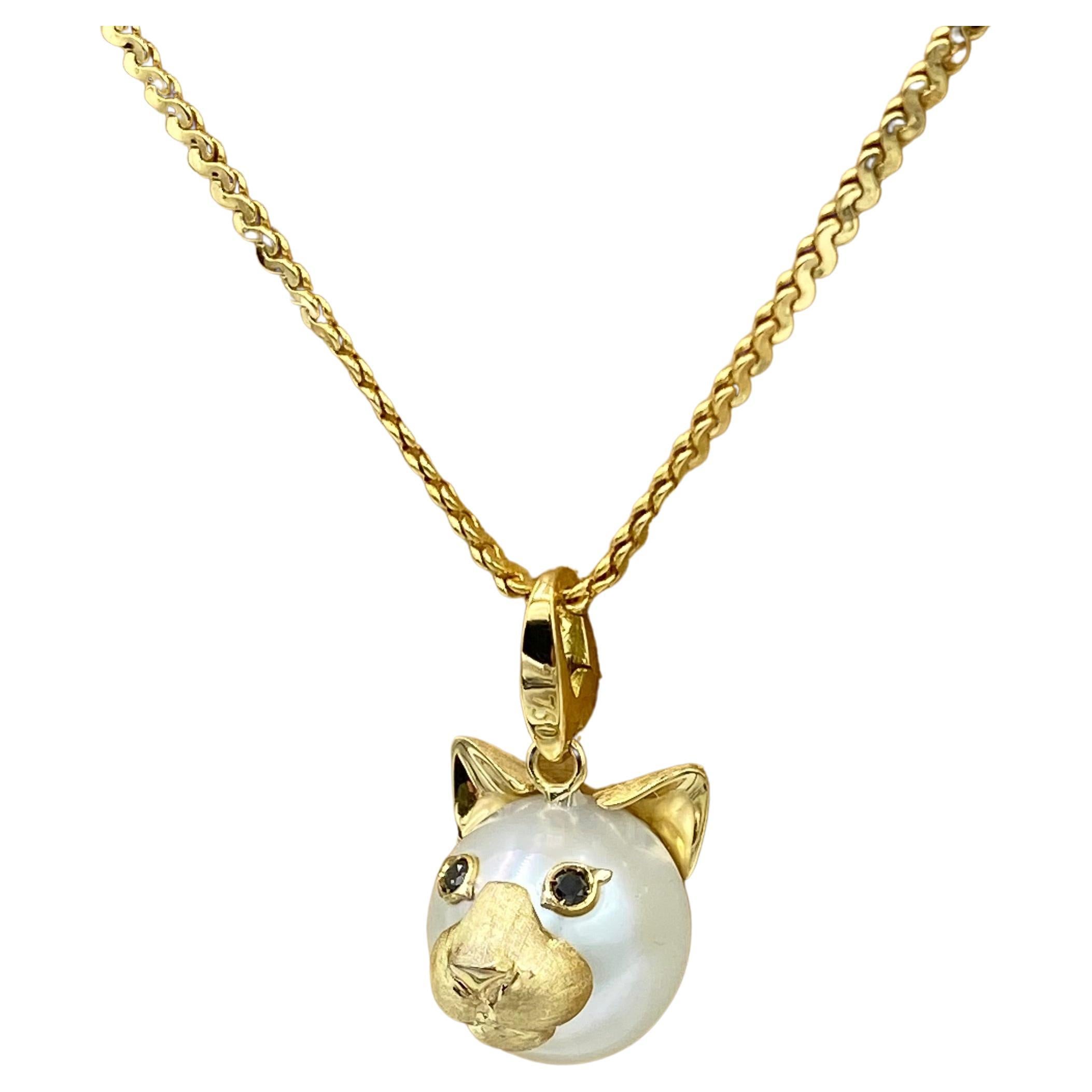 Cat Black Diamond 18 Kt Australian Pearl Charm or Pendant Necklace Made in Italy

The cat symbolizes curiosity, adventure and independence. It is an animal that has learned the art of patience and calm.

I use an Australian pearl to make a little