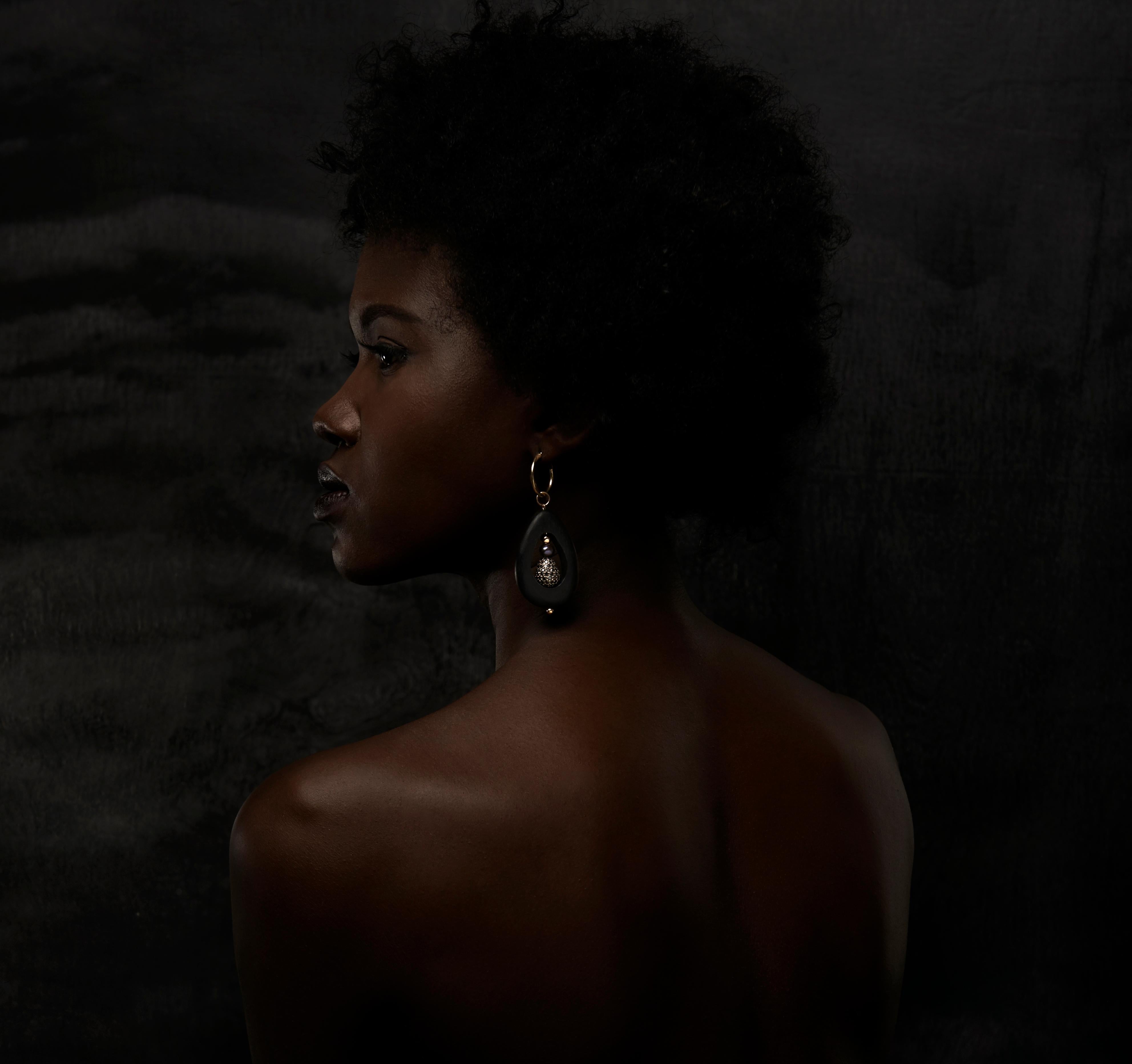 Black Diamond and Pearl Hoops by McKenzie Liautaud. Designed in New York.  Black Pave Diamonds and Black cultured pearls adorned with 14k Gold findings. 

Designed and created in New York by Mckenzie Liautaud.

In 2010 , Liautaud launched a capsule