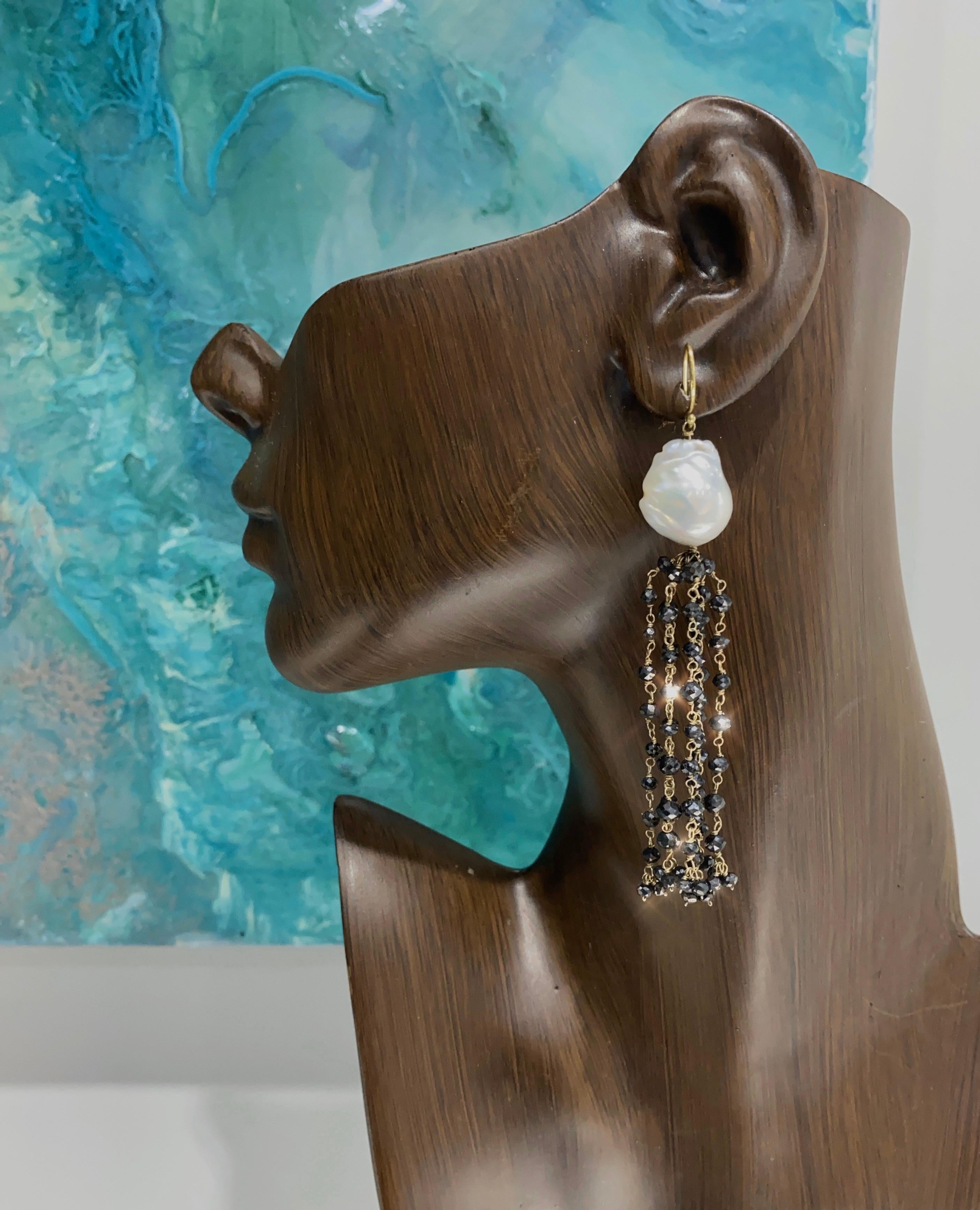 Make a statement with these beauties!  These elegant tassel earrings are handcrafted in 18k yellow gold with large freshwater baroque pearls, 15mm, mirror-like luster and micro-faceted, sparkling black diamond beads, over 10 carats!  They hang 3
