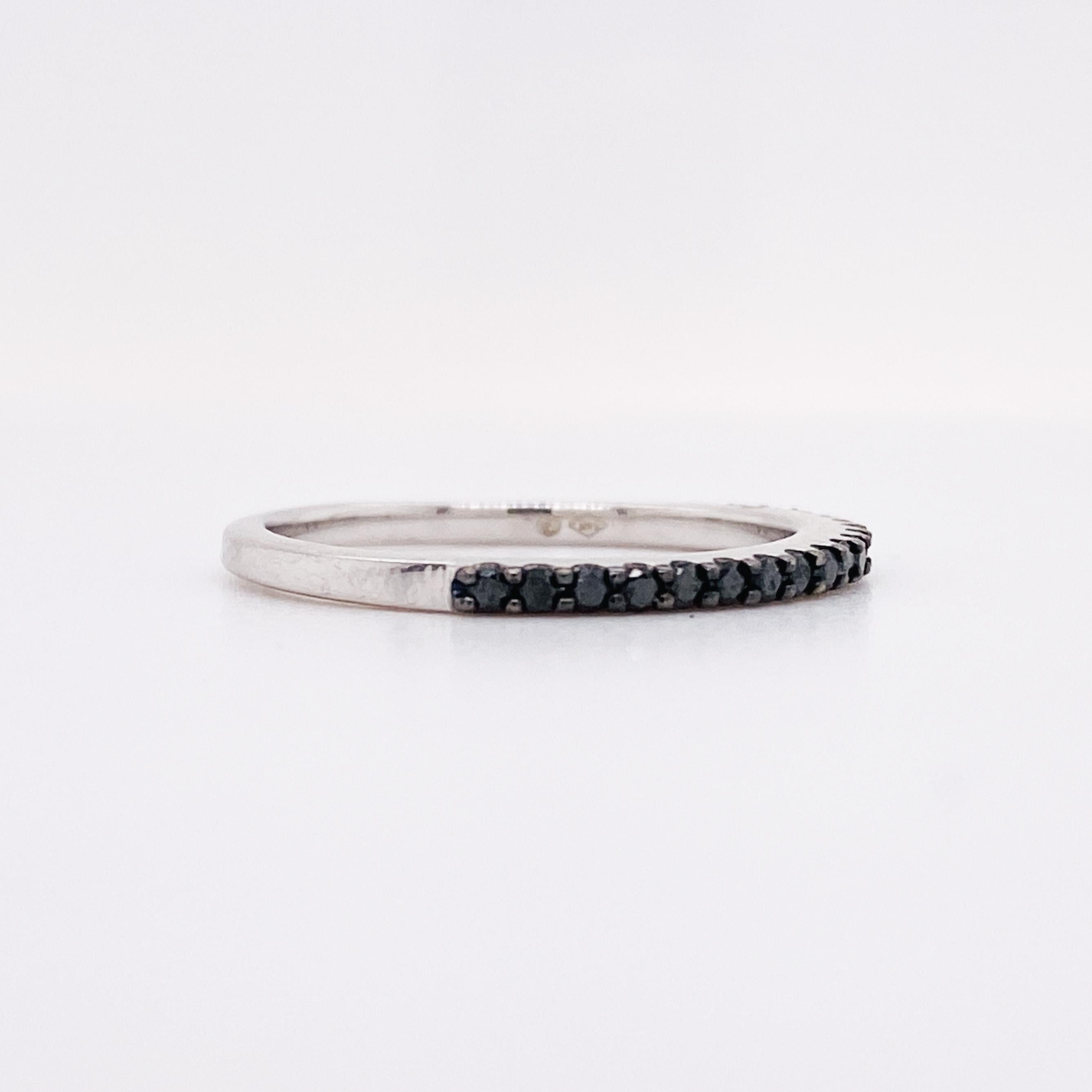 This black diamond band is very unique. The black and white gold are neutral colors that would pair really well with anything. This ring has stones across the top half of the finger. It is very sleek making it the perfect slender stackable band. The