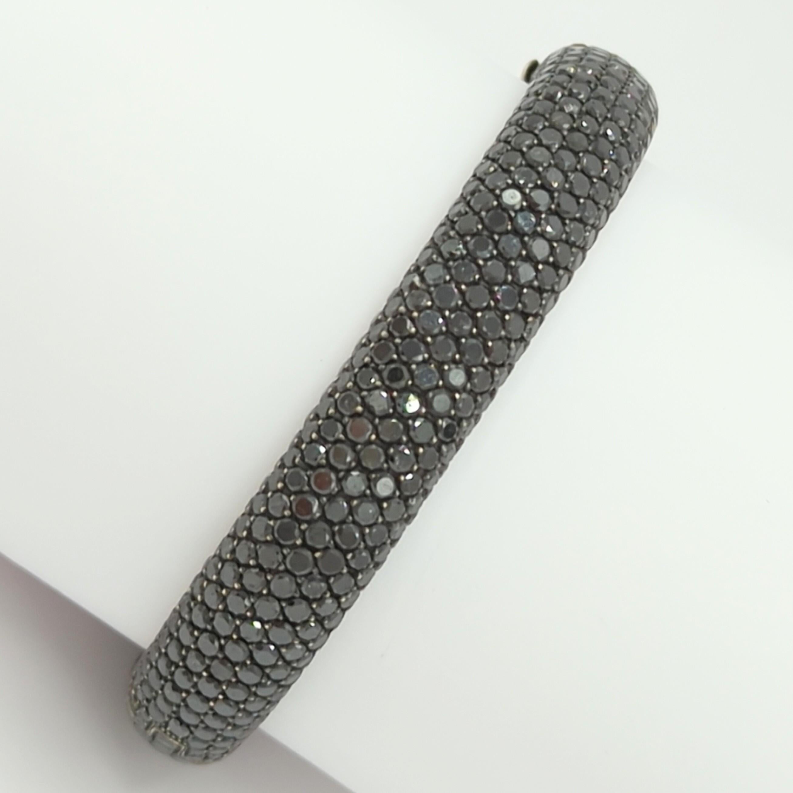 Gorgeous black diamond round bangle handmade in 18k white gold.  This bangle will go with any outfit and can be stacked with other bangles/bracelets or worn on it's own.  It is dramatic without being too flashy.
