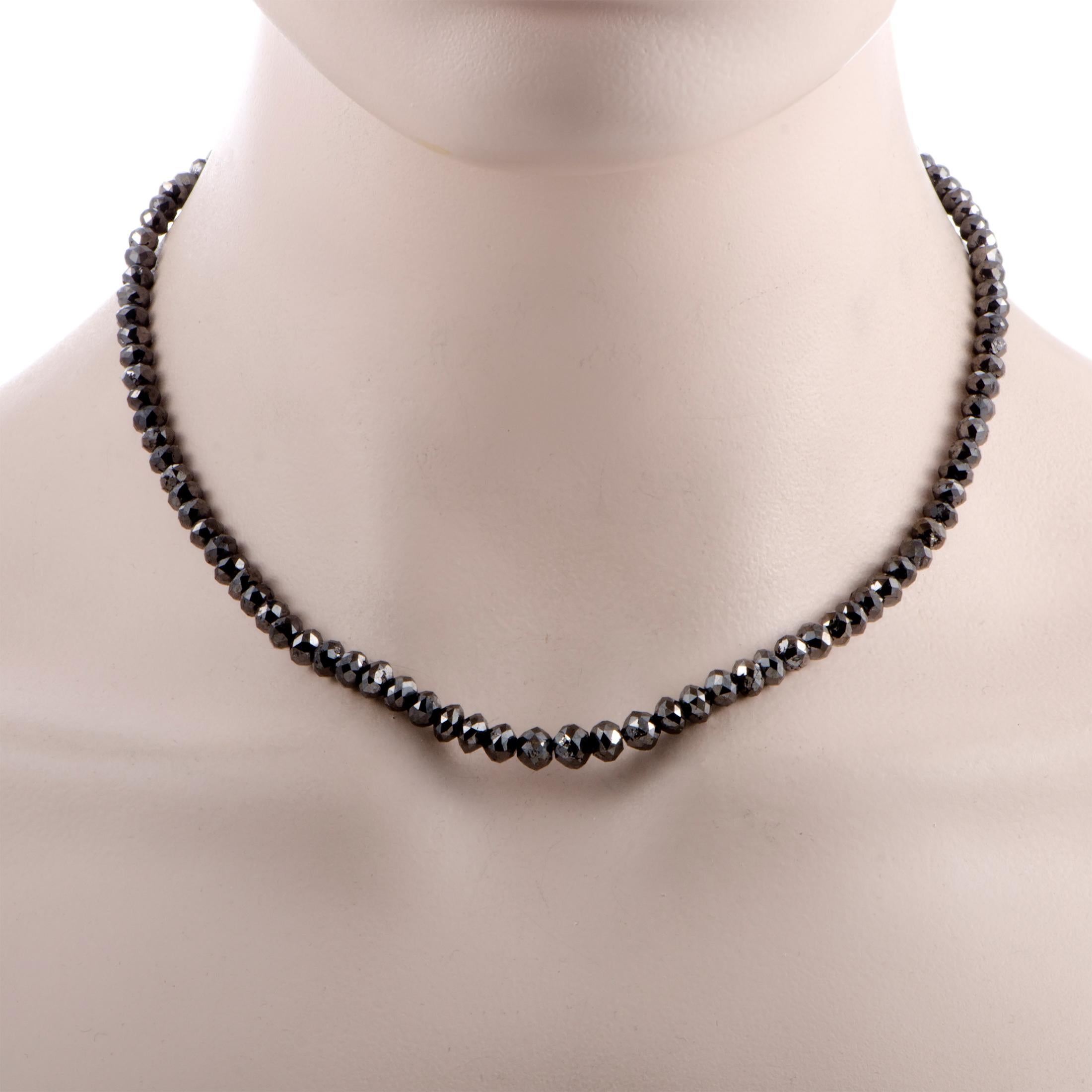 Brilliantly embodying elegant minimalism and bold modern style, this fantastic necklace is made of 18K white gold and lavishly lined with an astounding 110.00 carats of stunning black diamonds for a memorable sight.