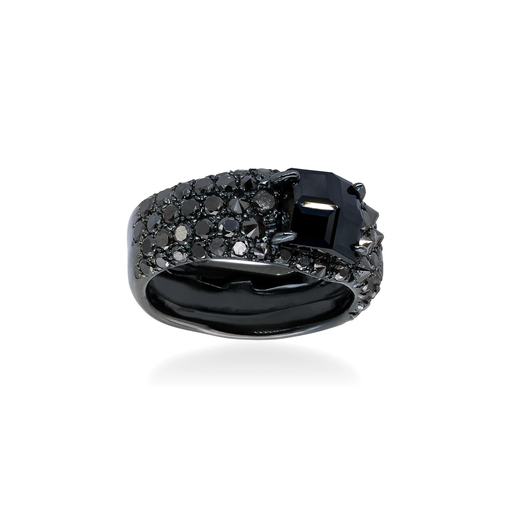 Black gold d'Avossa Ring with a central square cut Black Diamond of 3.45 cts on a pavé of 2.10 cts of black diamonds.
The cut of the central Diamond makes it extremely luminous an charming.
Perfectly suitable both for men and women, this Ring has a
