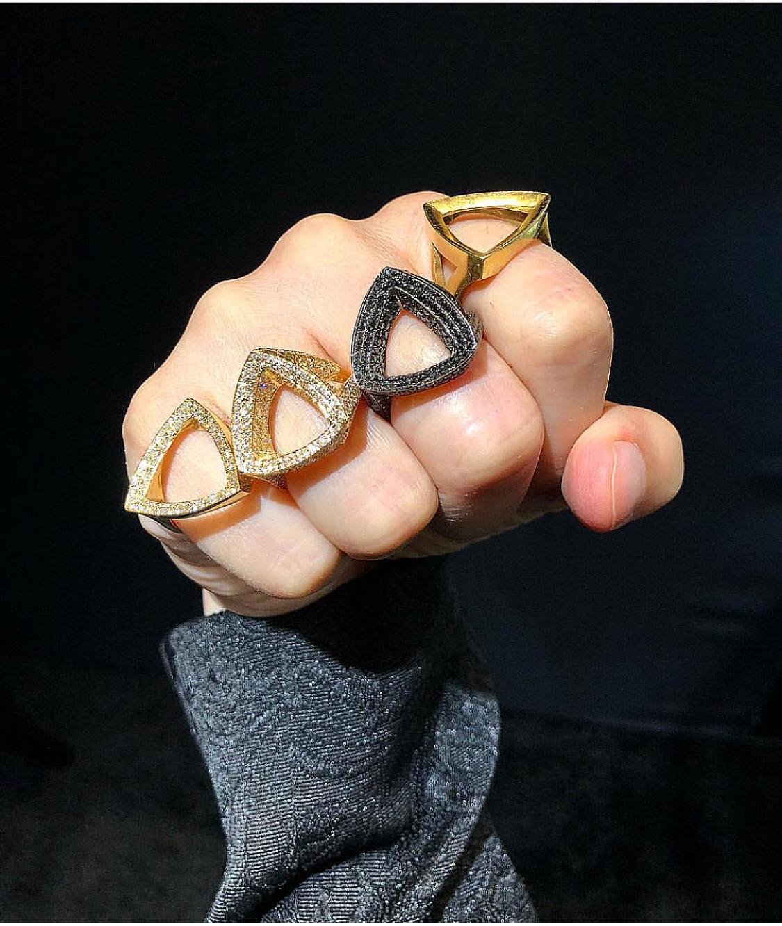 Black Diamonds to The Power of Three...  This Geometric Trilogy Ring is a large three dimensional beveled triangle set on rounded gold band covered in Pave Black Diamonds.

** PRICE for SIZE 7 
Contact Us for Other Sizes, Price Varies by Size
Other