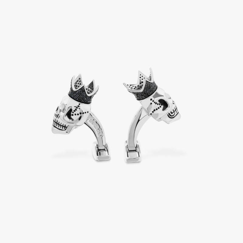 Black Diamond King Skull Cufflinks with White Diamonds in Sterling Silver

The classic Tateossian skull has been re-vamped adoring a diamond covered crown. The eyes of the skull are set with 4pcs of full cut white diamonds HI/ SI and 0.131cts per