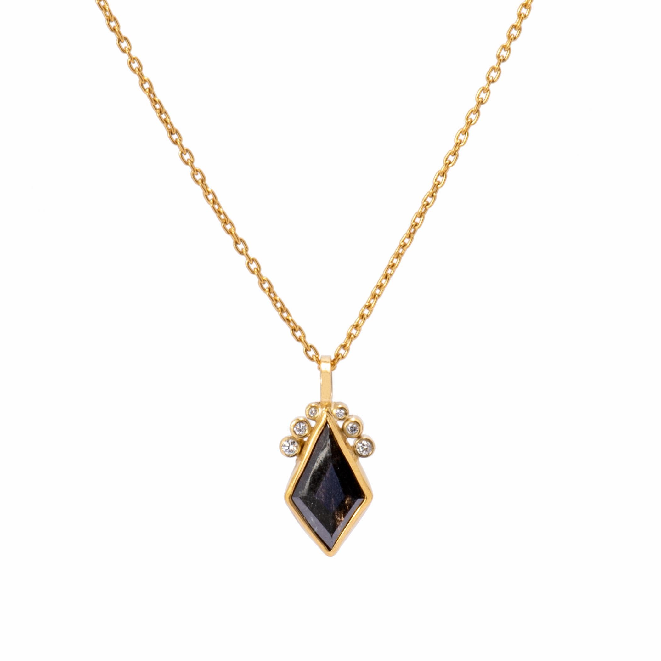 A rose cut slice of black diamond 1.5cts is bezel set in 22k gold with vertical kite shaped facets that catch the light to display smoky, charcoal depths. Crowned with 6 graduated beads set with bright white diamonds .07ctw, the black diamond kite