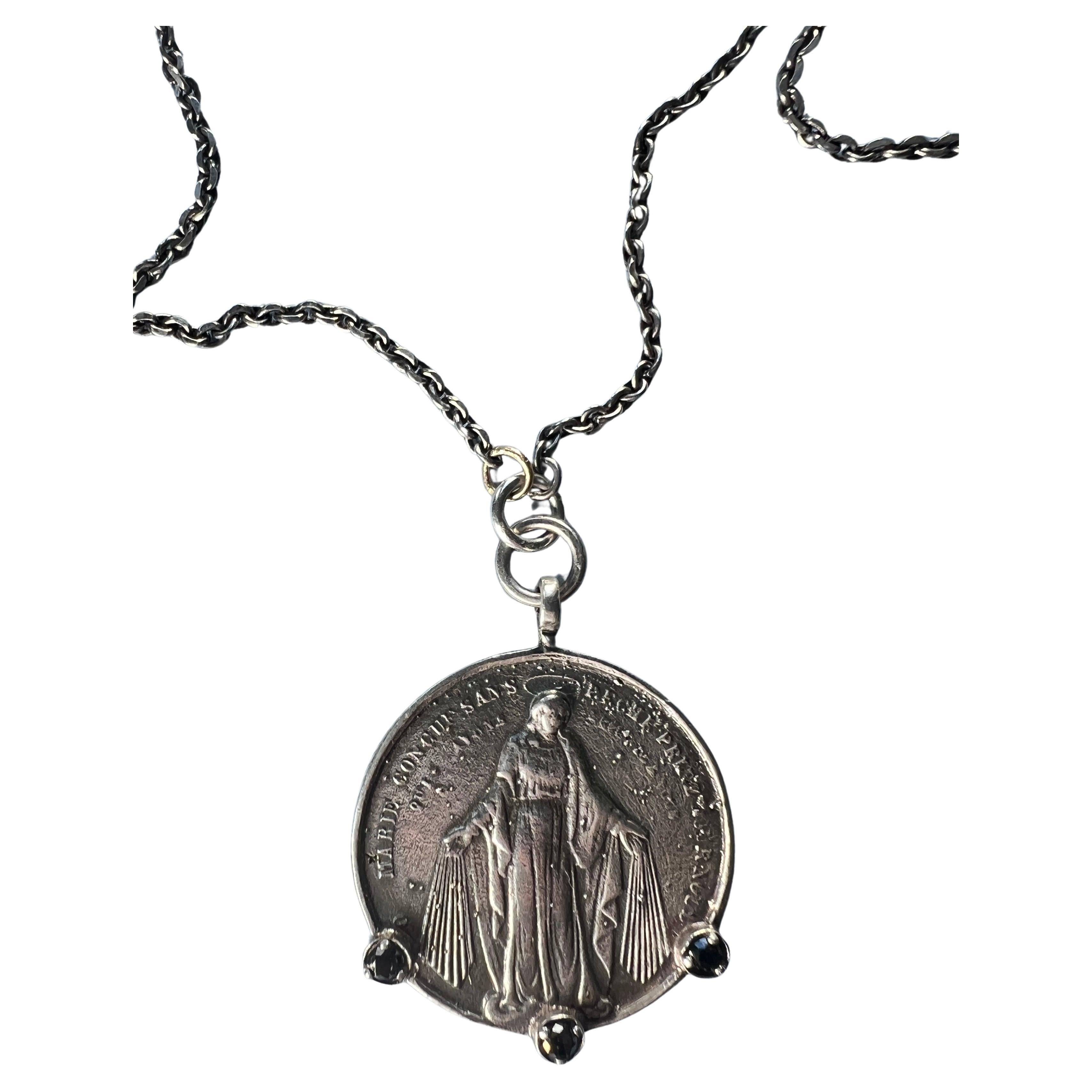 3 pcs Black Diamond set Silver Meda with Virgin Mary and Joseph on the back hanging on a vintage silver Chain Necklace also in Silver

Length: 29.5 inches

Designer: J DAUPHIN 

This medal necklace features three prominent black diamonds, which are