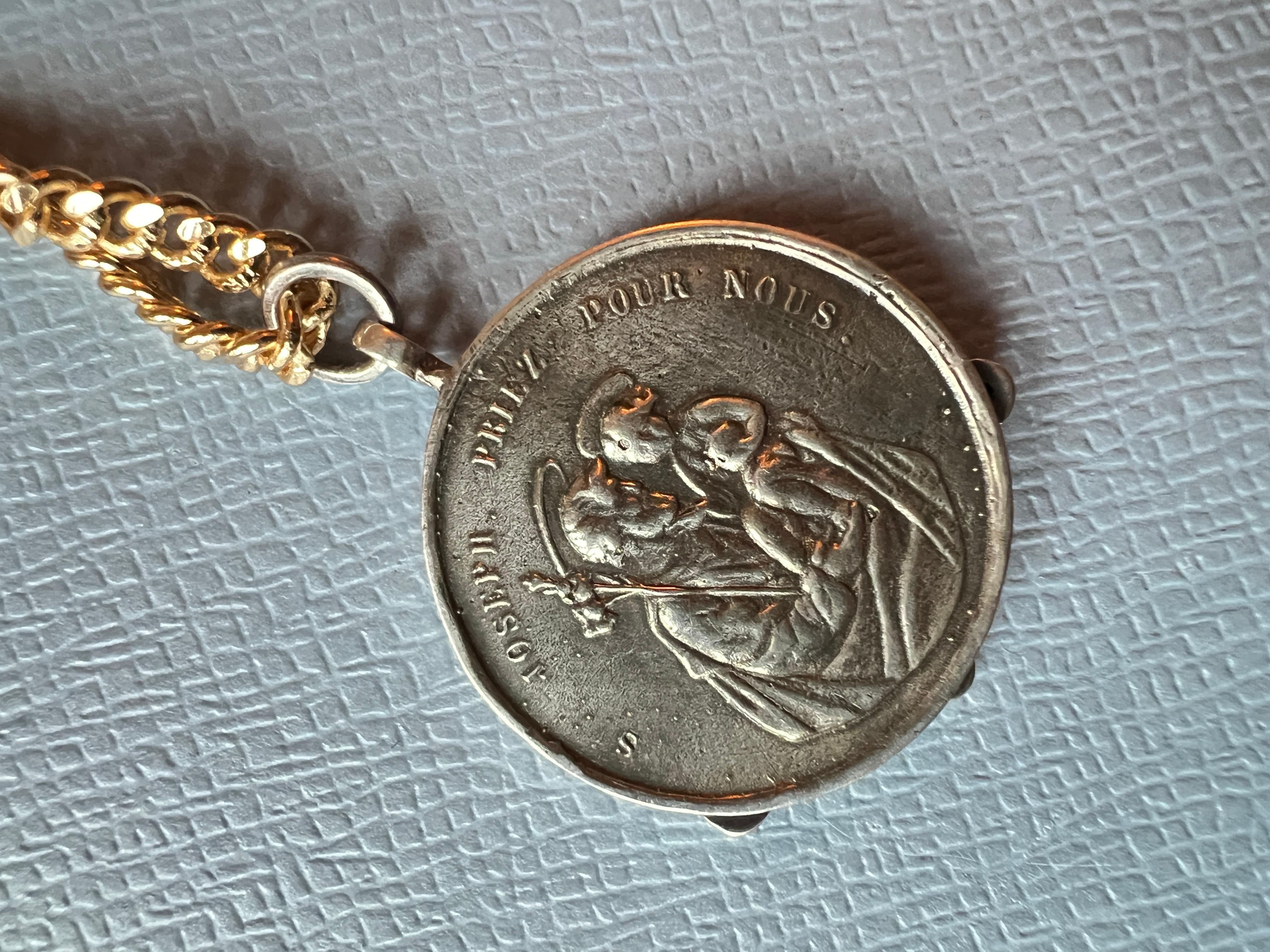 Black Diamond Medal Chain Necklace Virgin Mary Coin Silver
Chain Gold Plated Brass

Designer: J DAUPHIN 

Black diamonds, also known as carbonado diamonds, are distinctive due to their color and composition. Unlike traditional diamonds, which are