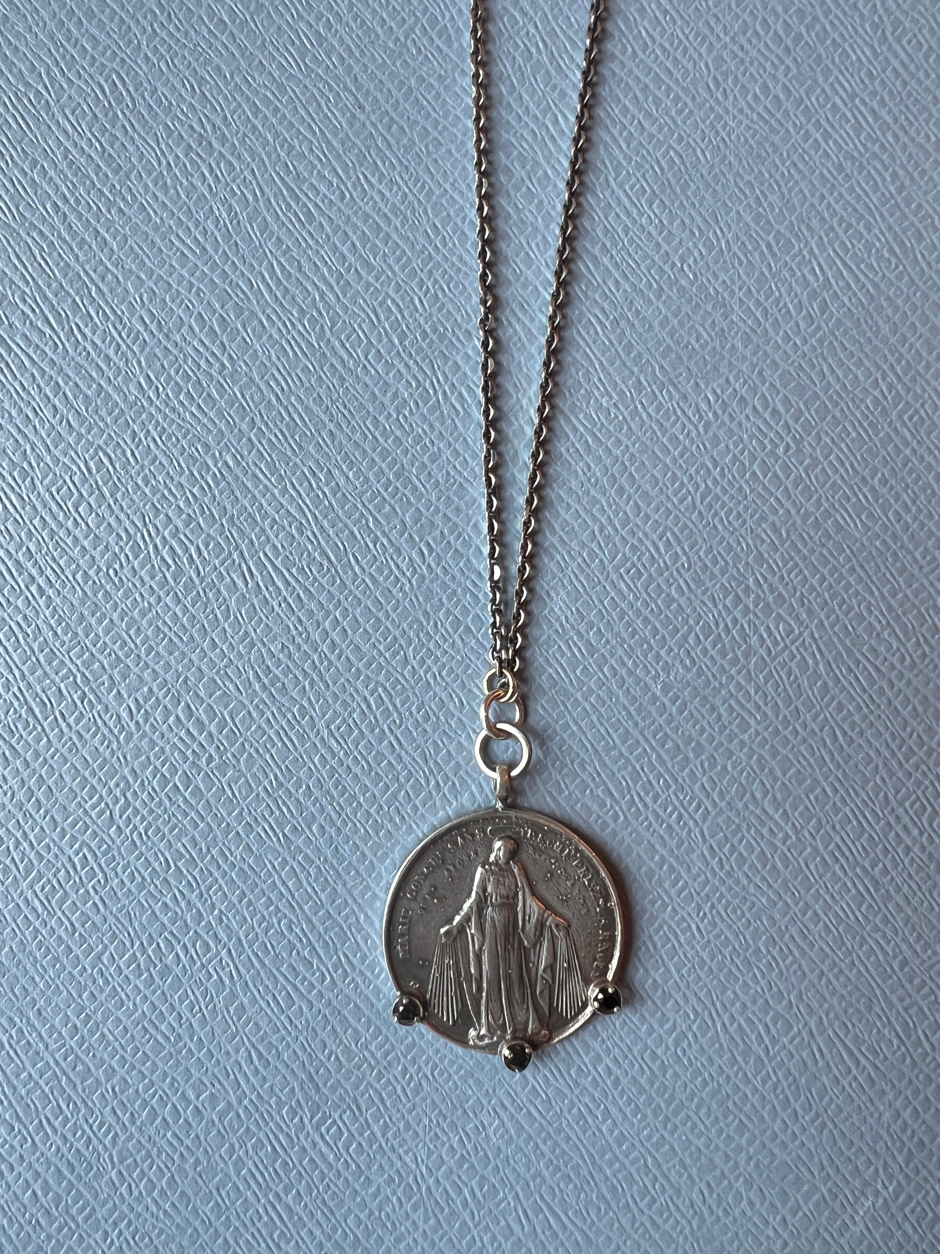 3 pcs Black Diamond set Silver Meda with Virgin Mary and Joseph on the back hanging on a vintage silver Chain Necklace also in Silver

Length: 29.5 inches

Designer: J DAUPHIN 

This medal necklace features three prominent black diamonds, which are