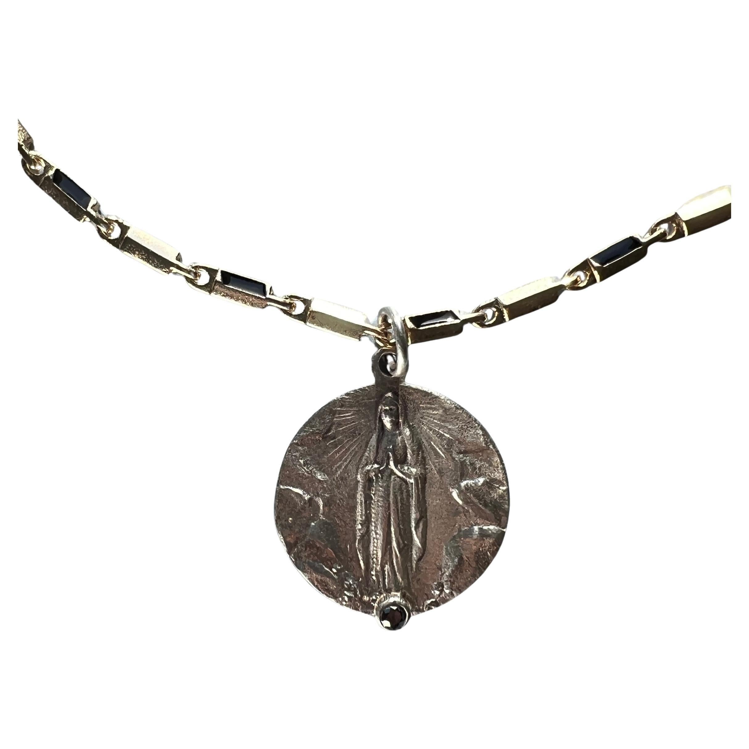 Black Diamond Medal Necklace Choker 

This Necklace is a 14k Gold plated Chain with a silver medal featuring Virgin Mary, It has a Black Diamond on the front. 

Length: Long 16