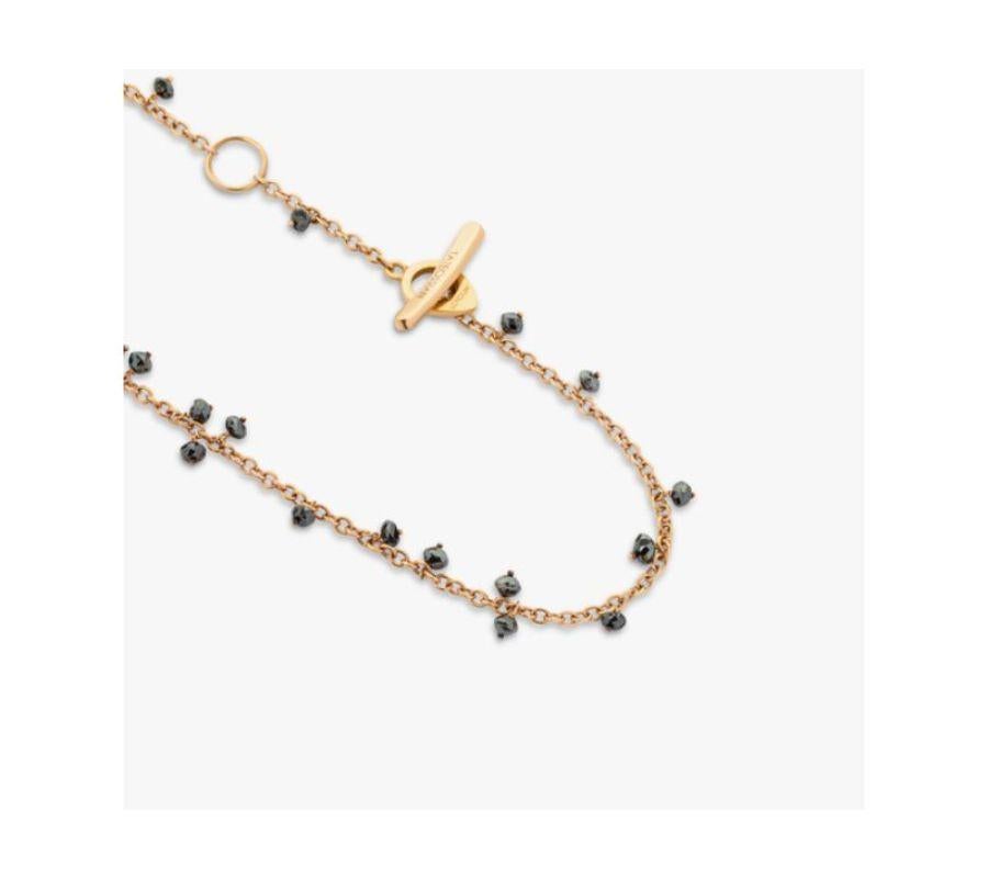 Black Diamond necklace in 18k rose gold

Sparkling black diamond stones adorn an 18k rose gold chain, scattered across the necklace in a modern cluster design. The single-cut diamonds are meticulously placed around the necklace, leaving your neck