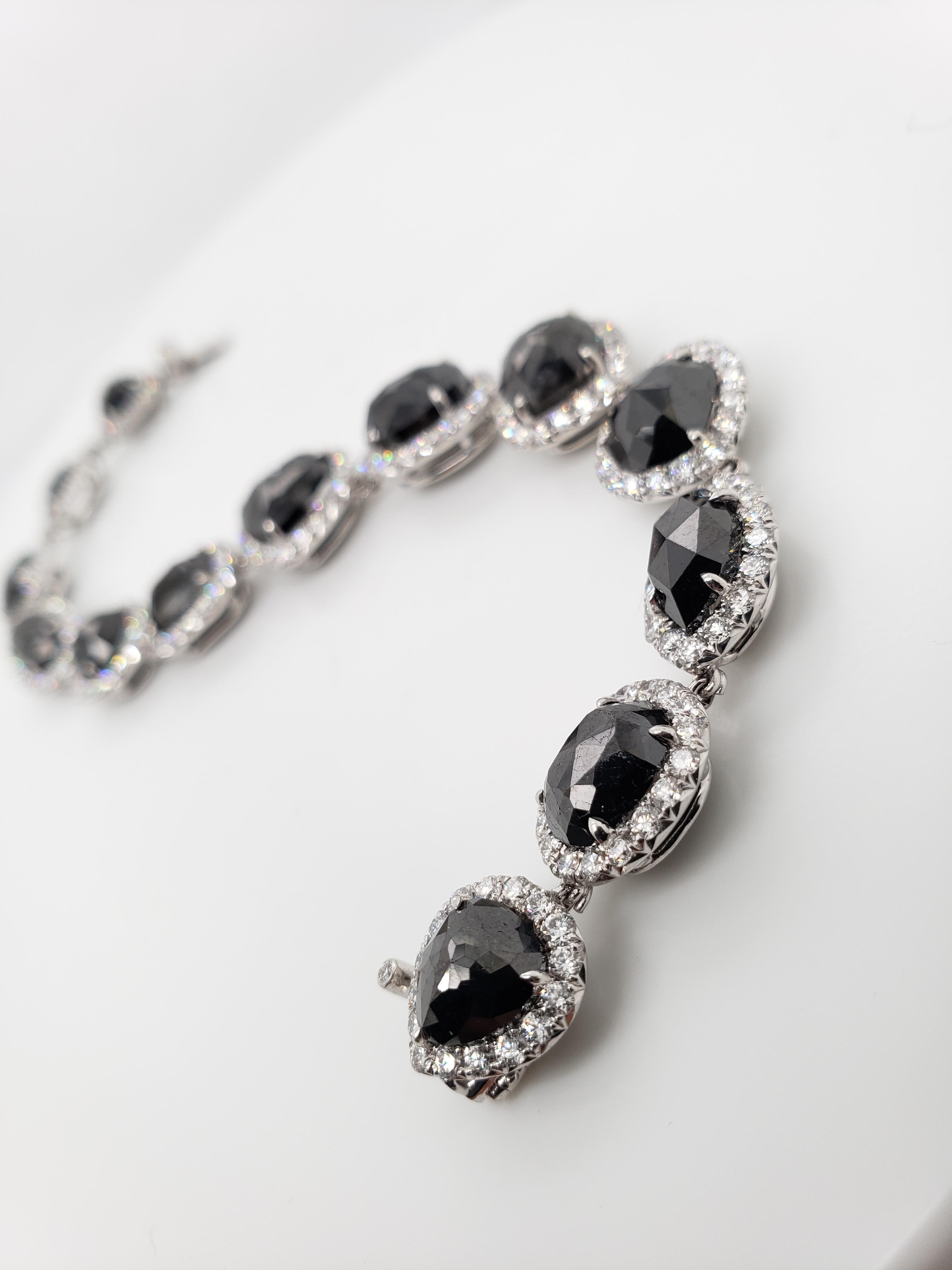 This unique straight line bracelet features 13 fathomless Rose cut Black diamonds in various shapes totaling 19.06 carats, edged in collection White pavé diamonds weighing 4.16 carats. Hand-crafted in 18K White Gold.
Clean & Chic; Fall into the