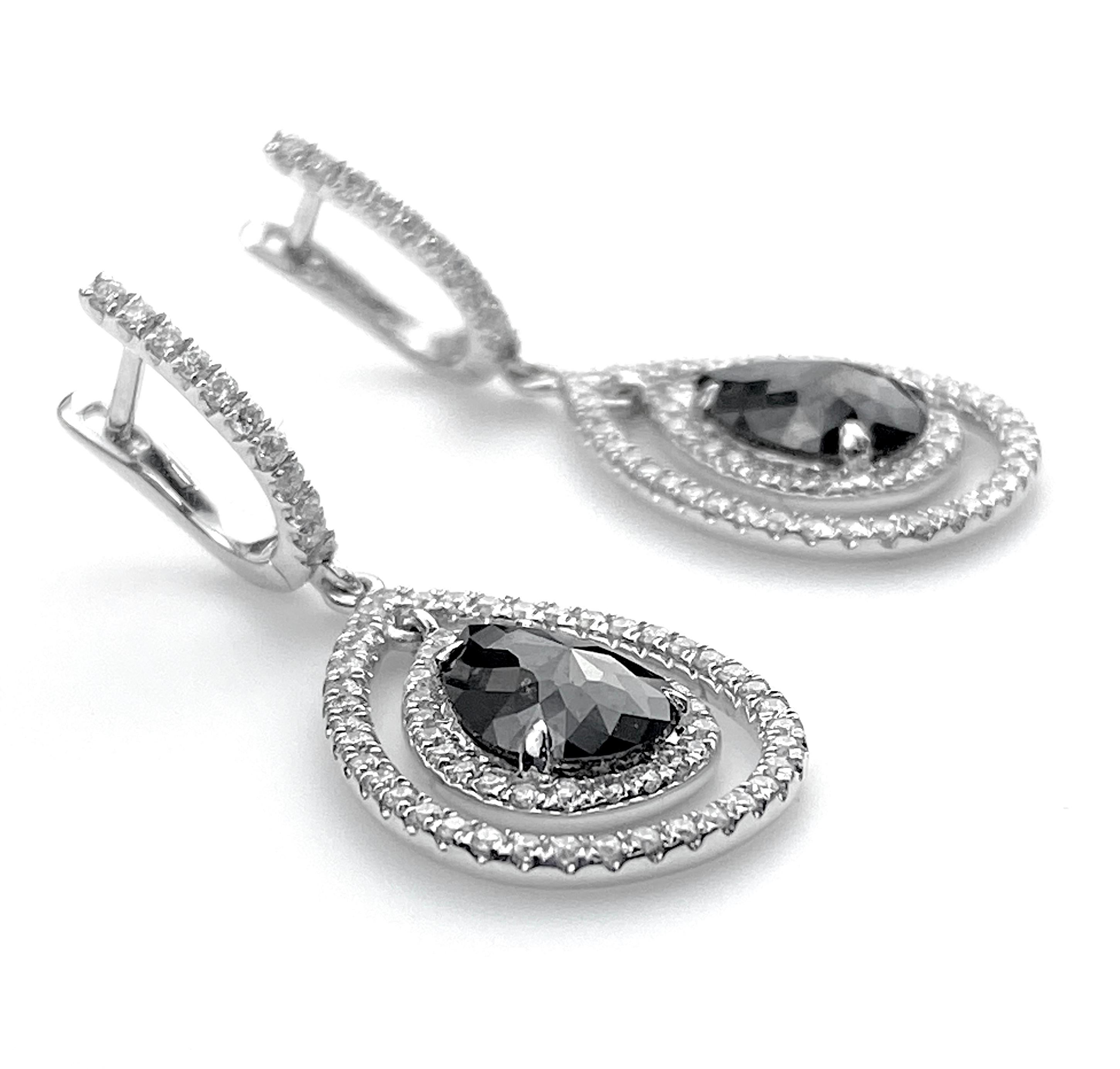 Contemporary Black Diamond Pear Cut Drop Halo Earrings with White Diamond Detail For Sale