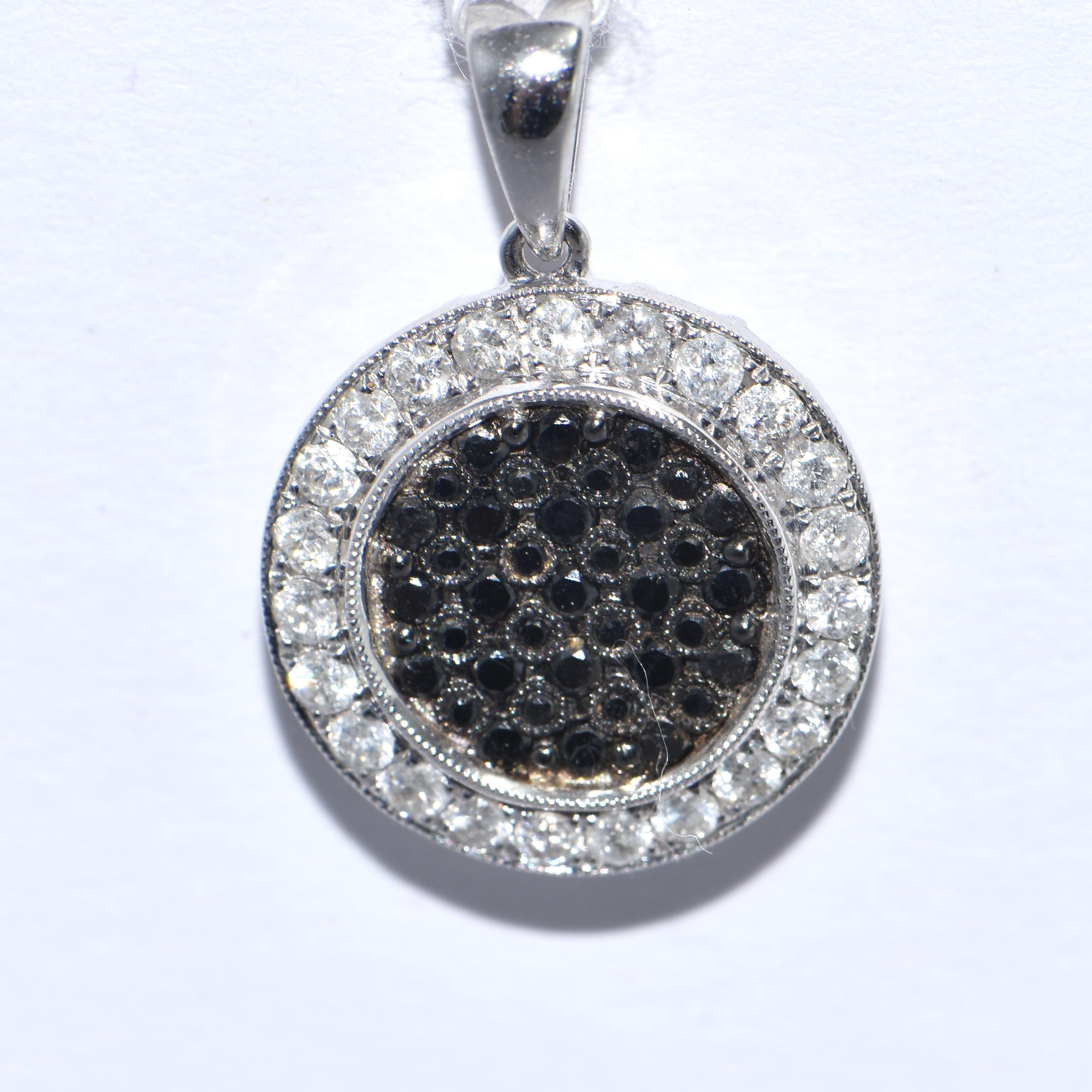 A Black and White Diamond Pendant

18 Carat White Gold
23 Round Brilliant Cut Diamonds 0.45ct
34 Round Brilliant Cut Brown Diamonds 0.38ct

A valuation report can be provided

FREE express postage usually 3-4 days Sydney to New York  
FREE