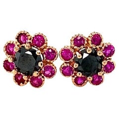 Orecchini a perno in oro rosa con diamante nero e zaffiro rosa