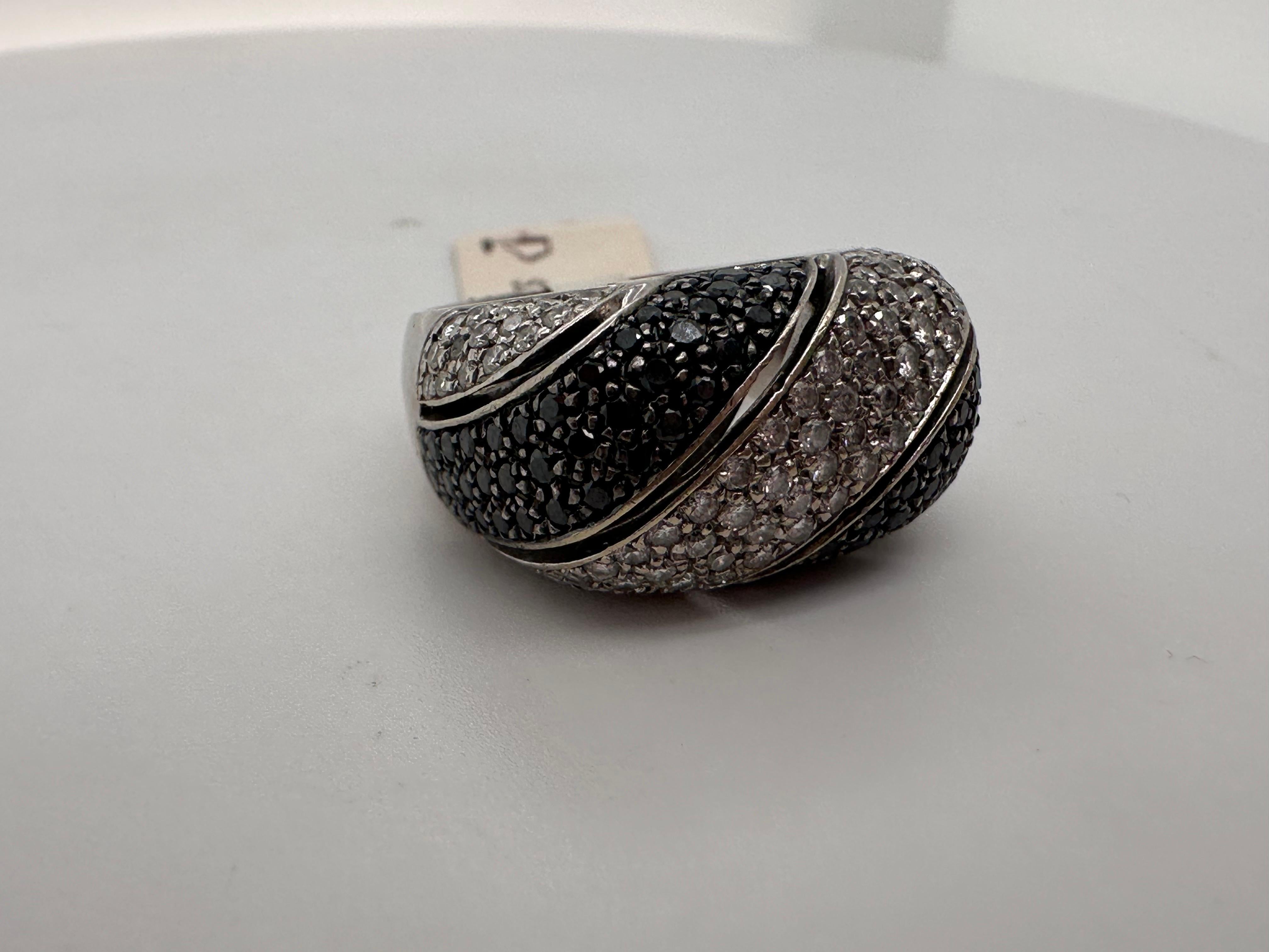Black and white diamond ring in 14kt gold.

Metal Type: 14KT

Natural Diamond(s): 
Color: G-H
Cut:Round Brilliant
Carat: 0.60ct
Clarity: SI 
Black diamonds weighing 0.70ct -100% natural

Certificate of authenticity comes with purchase!

ABOUT US
We
