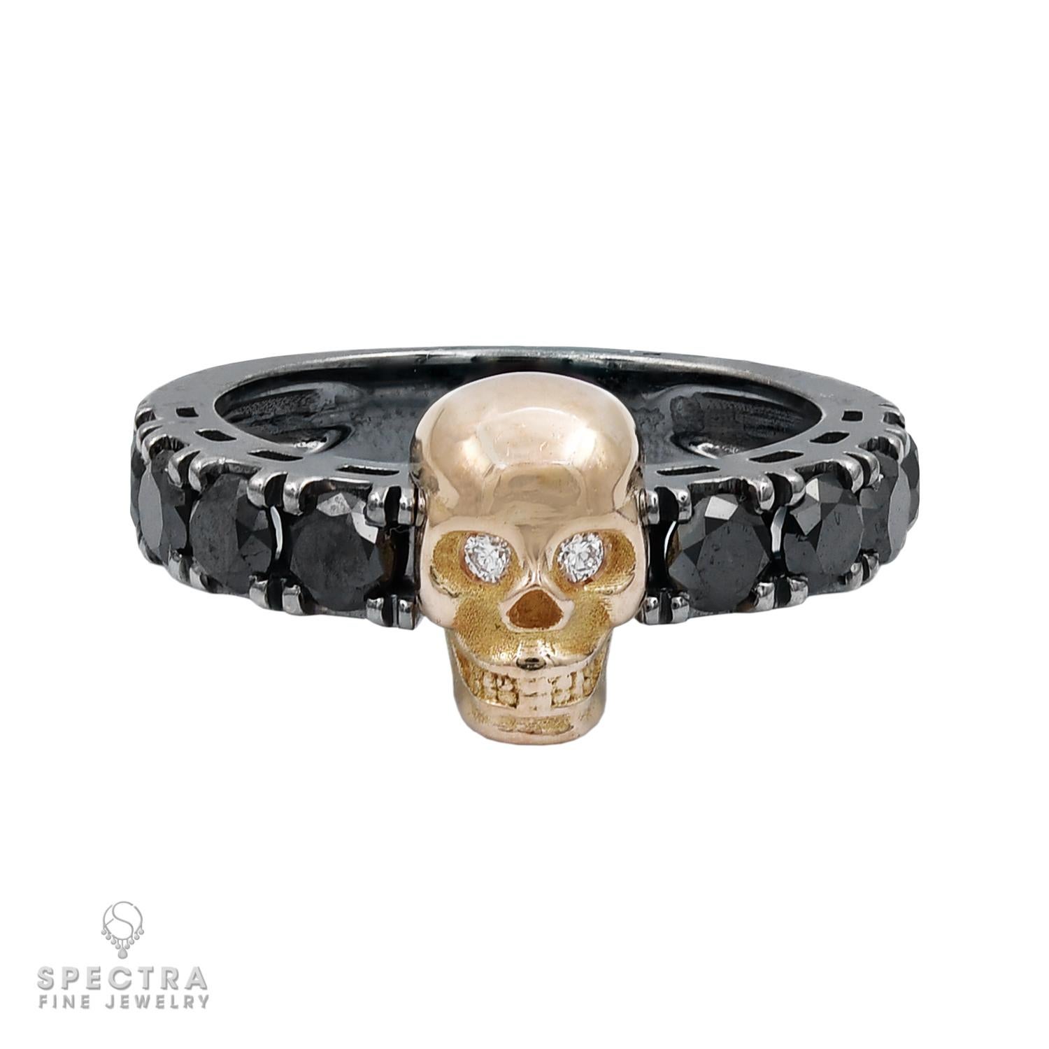 Black Diamond Skull Ring: A rose gold skull with diamond eyes exudes mystery and sophistication. 

It features 8 black diamonds and totals 1.20 carats. 

Crafted from 18k gold, weighing 6.00g, sized at 6.5. Perfect for adding refined rebellion to