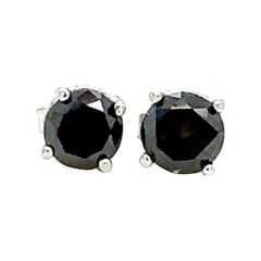 Boucles d'oreilles en or blanc 14 carats avec diamant noir