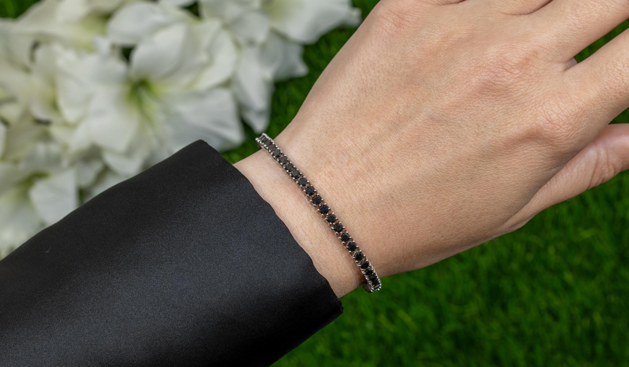 It comes with the Gemological Appraisal by GIA GG/AJP
All Gemstones are Natural
Black Diamonds = 5.40 Carats
Metal: 18K White Gold Plated Sterling Silver
Length: 7 Inches*
*The length can be adjusted on request