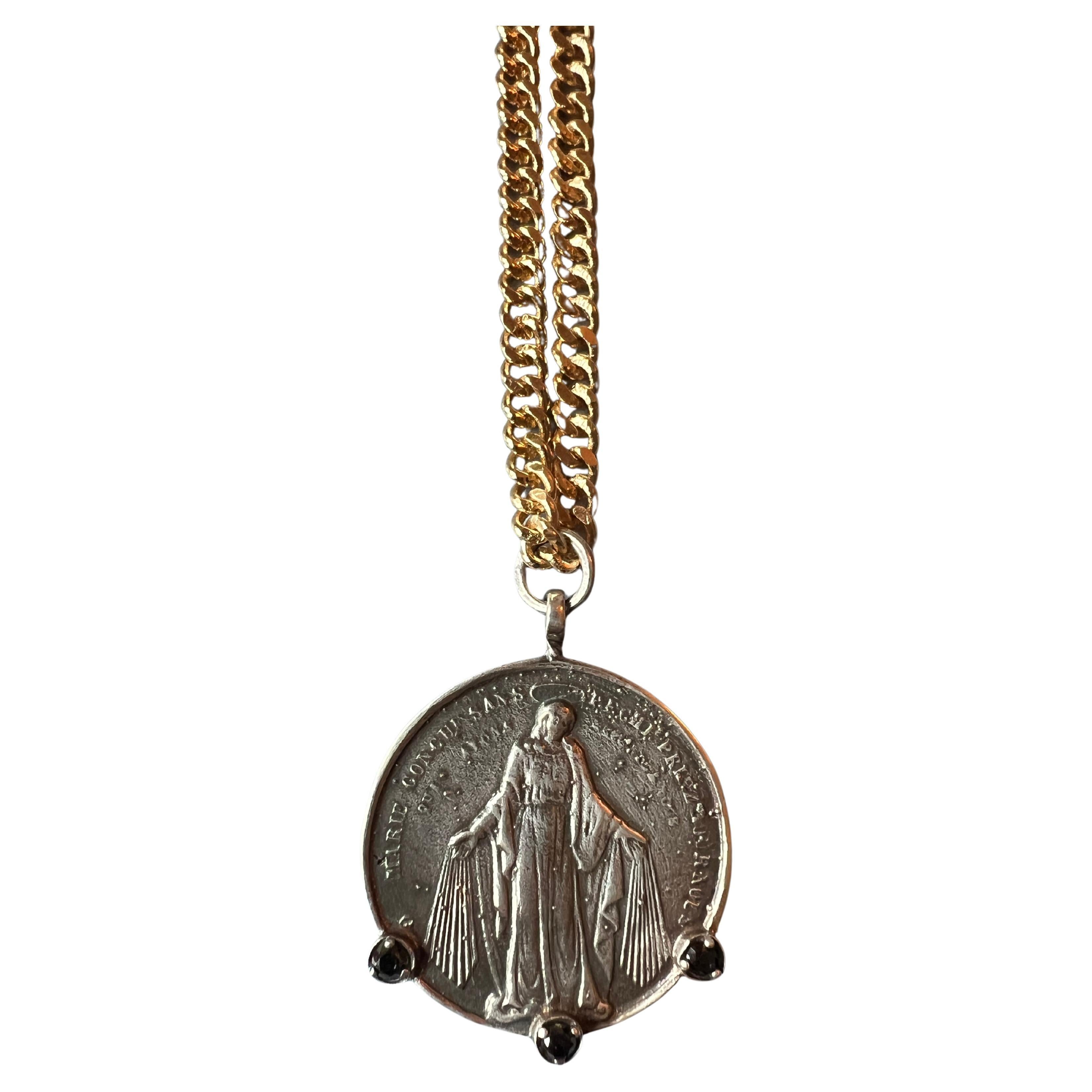 3 Black Diamond on a Silver Medal Virgin Mary Pendant on a Gold plated Chain Necklace

Designer: J DAUPHIN 

Black diamonds, also known as carbonado diamonds, are distinctive for their dark hue and unique origins. Unlike traditional diamonds formed