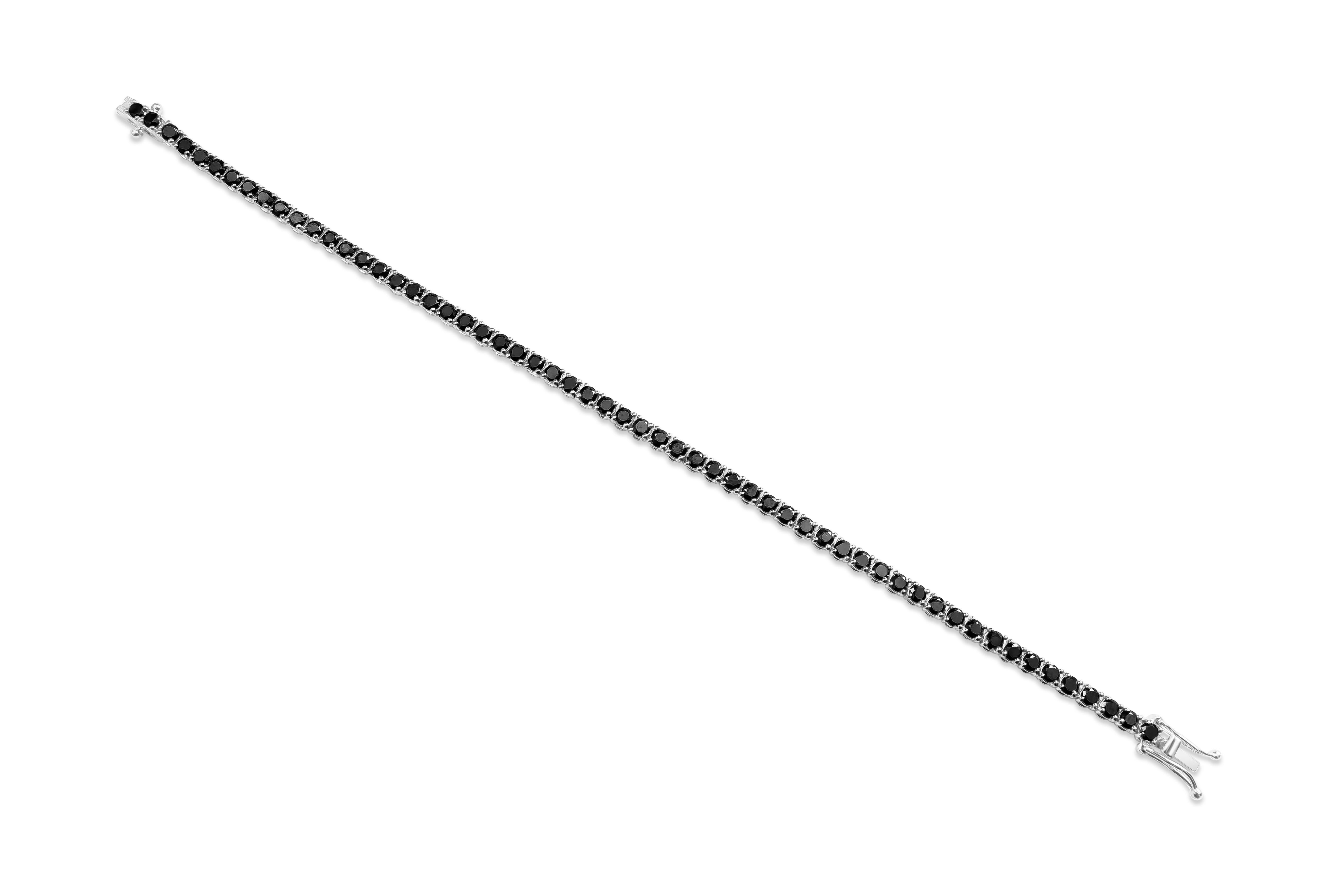 This tennis bracelet features 58 round brilliant black diamonds weighing 4.86 carats total set in a 4 prong setting. Made in 18k white gold. Size is 7 inches.

Style available in different price ranges. Prices are based on your selection of the 4C’s